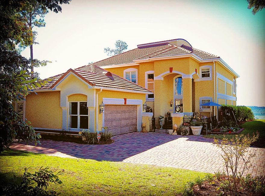 SECLUDED ELEGANCE! This private and custom Tuscan style home sits at the end of a cul-de-sac and is nestled between 145 ft. of Choctawhatchee bay waterfront and nature preserve! Large covered patio, boardwalk, dock, and lift are all conveniently located on property. Bamboo and antiqued terrazzo floors, granite countertops, DCS gas stove, Asko dishwasher, Sub-Zero refrigerator, custom wood cabinets, butcher block kitchen counter, oversized breakfast area and amazing family room with 20' cathedral beamed ceiling, grand fireplace, and huge curved Royal Red onyx marble bar backing up another cooking area and wet bar. A perfect home for entertaining or raising a family. Magnificent details and upgrades complete this home. Large Pela windows throughout capitalize on the bay views.  The upstairs area is just as amazing with an incredibly large office/sunroom and hobby room with picturesque windows looking onto the blue water of Choctawhatchee Bay. The fourth bedroom upstairs does not have a standard closet.  What could be the closet is currently the art studio. This extremely unique home is beautifully appointed and is located in a quiet gated community. You'll notice the magnificent grandeur of this stylish home from the moment you enter the gates of the Tuscan courtyard. Sunset Beach Clubhouse, Pool, Beach. HOA provides lawn service.  Come on in and be wowed!