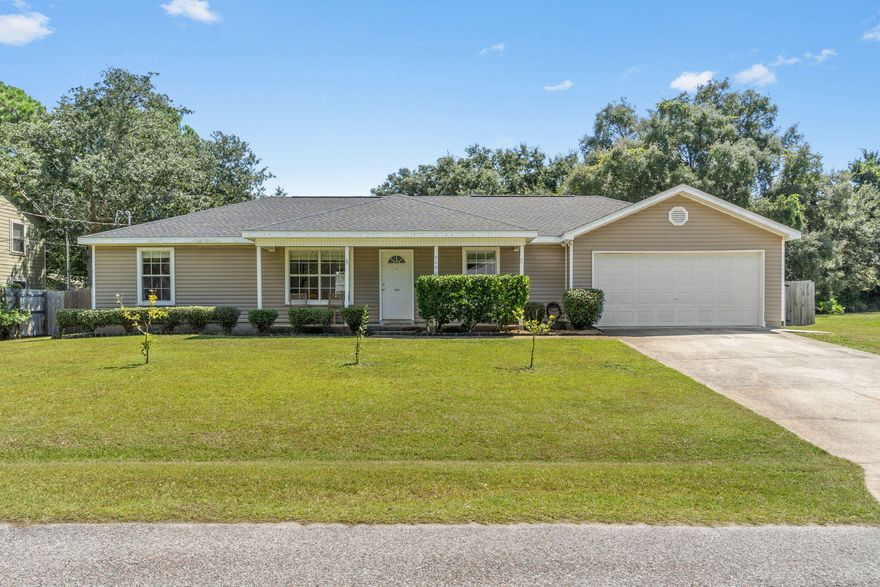 Roof and water heater brand new in 2023! Welcome to this beautifully updated Navarre home on a spacious 0.41-acre lot. Featuring 3 bedrooms, 2 baths, plus a bonus room, this home boasts brand-new LVP flooring and fresh paint throughout. The kitchen shines with new quartz countertops, refreshed cabinets, and overlooks the oversized backyard. Laundry room includes new built-ins, and board and batten accents add charm to the entry and guest bath. Enjoy a fully wood-fenced backyard -- perfect for pets, play, and entertaining. Conveniently located just minutes from shopping, dining, grocery stores, schools, and Navarre Beach, with easy access to parks and other local amenities. No HOA!