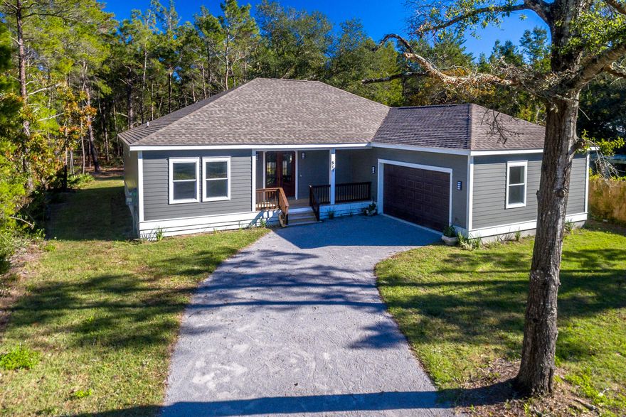 Custom built single family residence available now in the desirable Point Washington area of Santa Rosa Beach. This 4BR 3BA home sits on a secluded quarter acre lot within walking distance to the Choctawhatchee Bay. Little Canal Dr. is just 10 minutes from the most popular shopping, restaurants, and public beach accesses along trendy HWY 30A and Grayton Beach. Also close to HWY 331 N and access to I10, and just 20 minutes from the Silver Sands Outlet Mall and Sandestin Resort. The custom construction features an oversized mahogany double door entryway with half bath, an open concept living/dining/kitchen with beautiful backyard views and lots of natural light, and beautiful hardwood flooring throughout main areas. Coastal paint colors throughout.