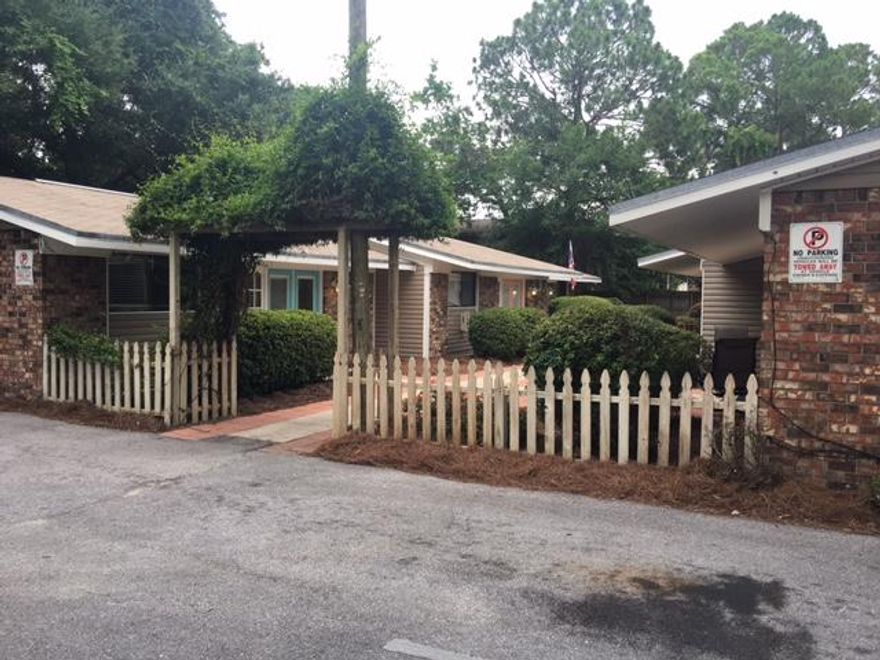 Incredible income potential with these units. These 2BR/1BA open up to a cozy 6-plex courtyard with a welcoming arbor. This unit is all on one ground level. The front french door features between glass blinds with both doors opening to provide easy assess for larger furniture. The bedrooms have mirrored sliding doors and ceiling fans. It is carpeted in both bedrooms with tile in the living room, kitchen, and bath. The units are well-kept and clean. Plantation blinds are provided on all windows. A fence provides privacy around the 6-plex unit. Commercial laundry facilities are within walking distance. 5 of the 6 units have been updated with central air, newer appliances, paint, applainces and kept in great shape!