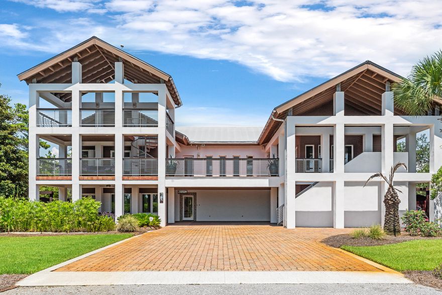 Welcome to your dream coastal retreat! This stunning custom-built home is situated on a spacious third-acre lot south of the west end of 30A, offering breathtaking Gulf views and an enviable location across the street from Topsail Preserve State Park. With nearly 4,000 sq. ft., this magnificent residence combines luxury, comfort, and exceptional craftsmanship. Dive into the large, sparkling, heated pool or host gatherings around the summer kitchen. Enjoy the warmth of an outdoor fireplace in the Fall and Winter. The landscaped yard also features a serene koi pond, creating a perfect ambiance for outdoor enjoyment. The oversized balcony and additional ''crows nest'' provide panoramic Gulf views, making it an ideal spot to watch the sunset. Just a golf cart or bike ride away to the beach.