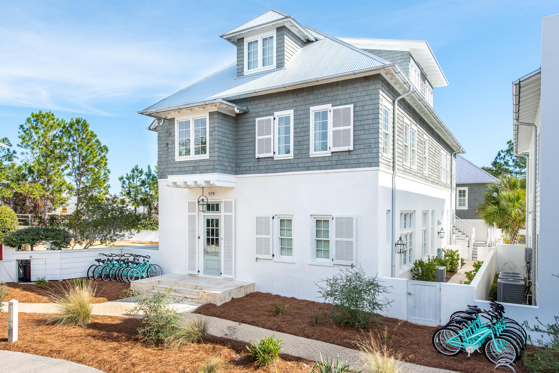 Comfort truly meets chic in this luxury Benecki home, steps away from the Rosemary Beach Fitness Center and Racquet Club. Complete with three floors of ultimate luxury, soothing neutral tones on the Venetian plaster walls greet you upon entry. Eyes avert upward, showcasing a grand staircase adjacent to the first master suite. The master is home to a spa-style private bathroom, which features double vanities and walk-in shower of Carrera marble.Make your way through the foyer and into the ultra-modern kitchen. The kitchen overflows to a grand scullery with a second dishwasher, additional sink, and plenty of storage. Enjoy ample space for meal preparation as your guests are seated around the kitchen island, featuring lush, woven bar seating. With a large open floor plan, and a six burne