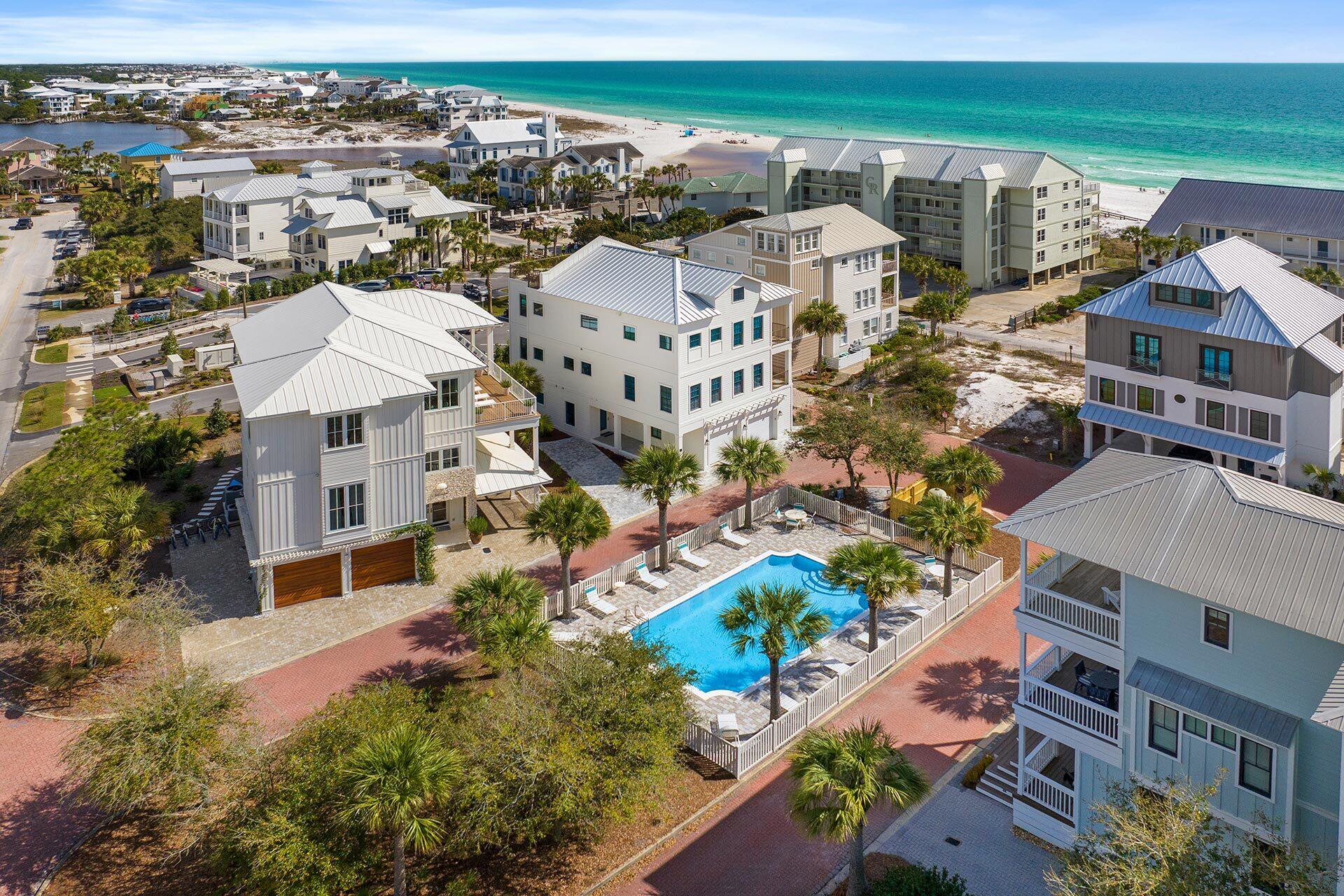 Come and see this beautiful turnkey investment property located in Seagrove! Completed in 2023, Sandcastle on Camelot is fully furnished and already producing short term rental income! Located in the small neighborhood of Dalton Place which includes a private pool and clubhouse for owner use. This beautiful, contemporary styled home is four stories with a 480 sq. ft. rooftop terrace on the fourth floor that looks out over Eastern Lake to the east and the Gulf of Mexico to the south. There is an elevator serving the first three floors. The home has five bedrooms and four and a half baths.