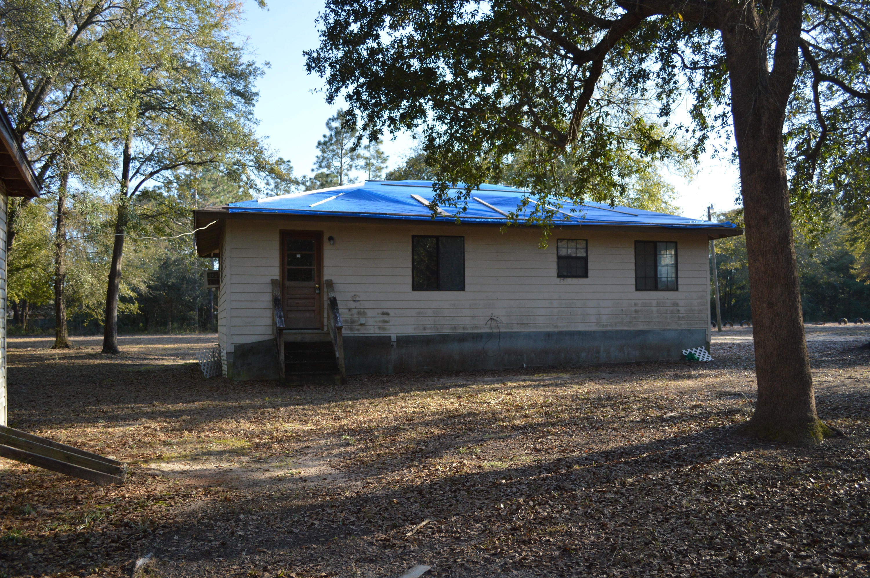 Lots of room to roam at a GREAT PRICE! Home needs some repairs. Cute home with front porch on just over 3/4 acre of land. Storage building in back. Call today for your personal tour!