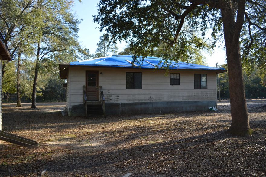 Lots of room to roam at a GREAT PRICE! Home needs some repairs. Cute home with front porch on just over 3/4 acre of land. Storage building in back. Call today for your personal tour!