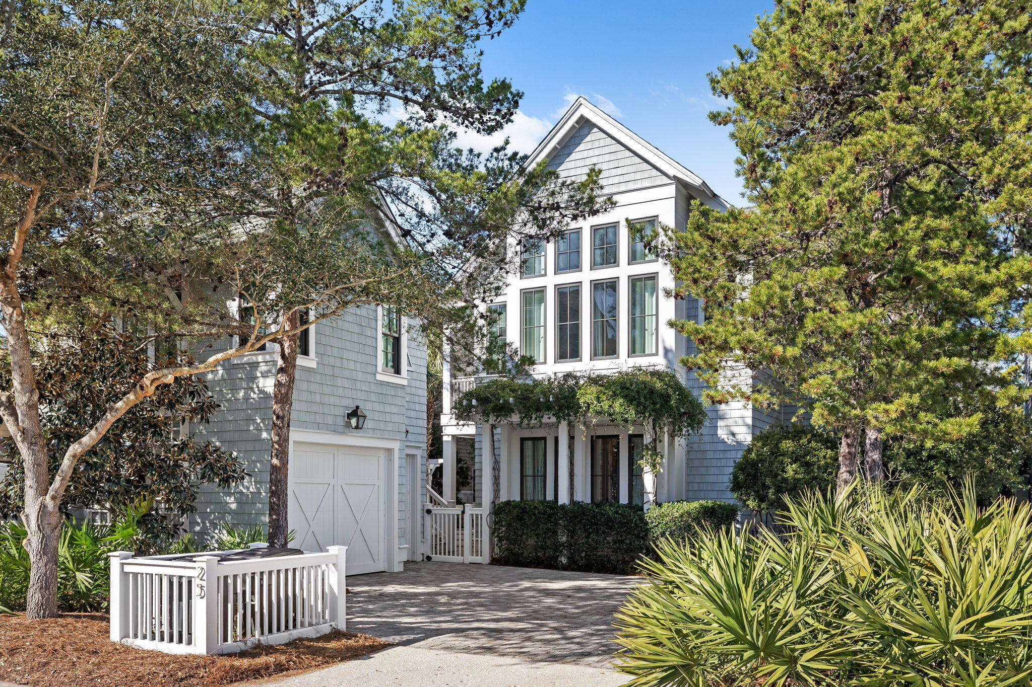 This fully furnished, Nantucket-style masterpiece is located in the highly desired gated neighborhood of Watersound Beach.  This magnificent 3 level home with an elevator offers impeccable design & quality finishes throughout. The main home includes 4 bedrooms and 6 baths w/a 5th bedroom & apartment w/a full bathroom located above the garage in the carriage house.  The bright open floor plan is professionally decorated with high-end furnishings and custom window treatments. The home has white oak flooring throughout, a gracious living area with vaulted ceilings & gas fireplace. The chef kitchen has an expansive island w/quartzite countertops & Thermador stainless steel appliances.  The home has two primary bedrooms w/ensuite baths and spacious walk-in closets. The bunkroom home is located off of a separate family room allowing for entertaining of friends. The home has four separate porches with a heated pool & water feature to enhance ultimate relaxation. The rental rate includes all utilities including the HOA, Cable/Internet, Pool & Yard Maintenance. 