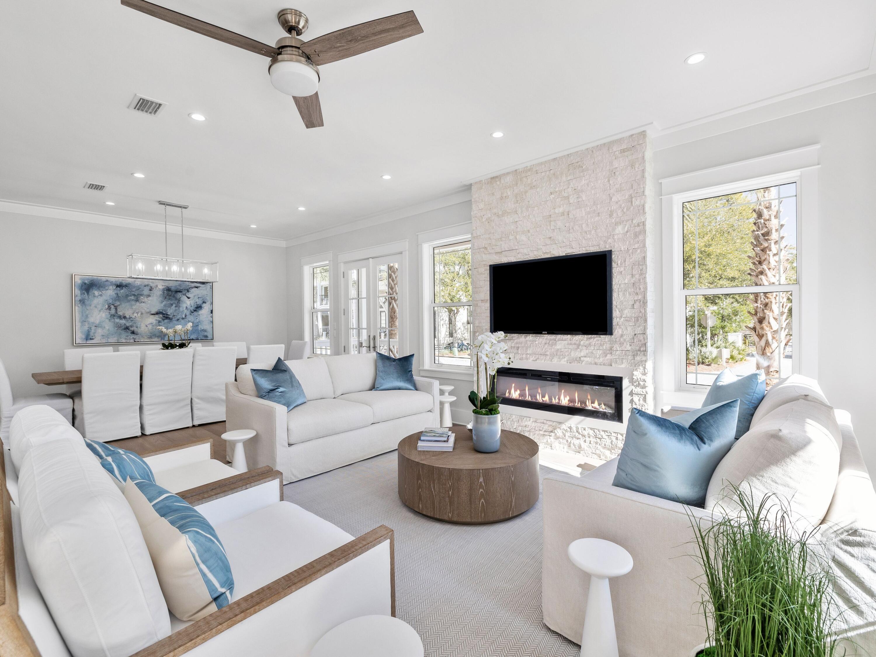 Nestled in the highly sought-after community of Seacrest Beach along the picturesque Hwy 30A, this exquisite newly constructed beach house is a true gem, being offered fully furnished for your immediate enjoyment. Boasting 5 spacious bedrooms and 5 and a half luxurious baths, this home is a blend of comfort and elegance, featuring stunning wood flooring that flows seamlessly throughout. The layout includes two primary suites--one conveniently located on the first floor and another on the third floor--providing privacy and comfort for all guests. With three inviting living areas, the main gathering space on the first floor is perfect for relaxation, complemented by a charming fire feature that adds warmth and ambiance. Ascend to the second floor to find a second living area, along with a sprawling covered outdoor living space, ideal for entertaining or simply soaking in the coastal breezes. The heart of the home, the open kitchen, captivates with its modern shaker-style cabinets, gleaming tile backsplash, and top-of-the-line appliances, sure to please any culinary enthusiast. Just outside the kitchen, you'll discover a beautifully designed wet bar, complete with open wood shelving, a wine refrigerator, and an ice machineperfect for hosting gatherings. Enjoy the fresh air and tranquil views from the porches attached to three of the five bedrooms, and relax on the two expansive porches off the first-floor living and kitchen area. Conveniently located, the Seacrest Beach shuttle picks you up right outside your door, whisking you off to the mesmerizing beach. Start your day with a delightful breakfast at a charming caf?? in the neighborhood, or explore the delightful options for dining, boutique shopping, and entertainment just a few blocks away in Rosemary and Alys Beach. Revel in leisurely strolls along the stunning white-sand beach or try your luck at fishing. Golfers will appreciate being just minutes away from the well-regarded Camp Creek Golf Club. For those who love nature, Camp Helen State Park lies to the north, offering a stunning natural environment rich in outdoor activities such as birding, hiking, kayaking, and fishing on the serene Lake Powell.