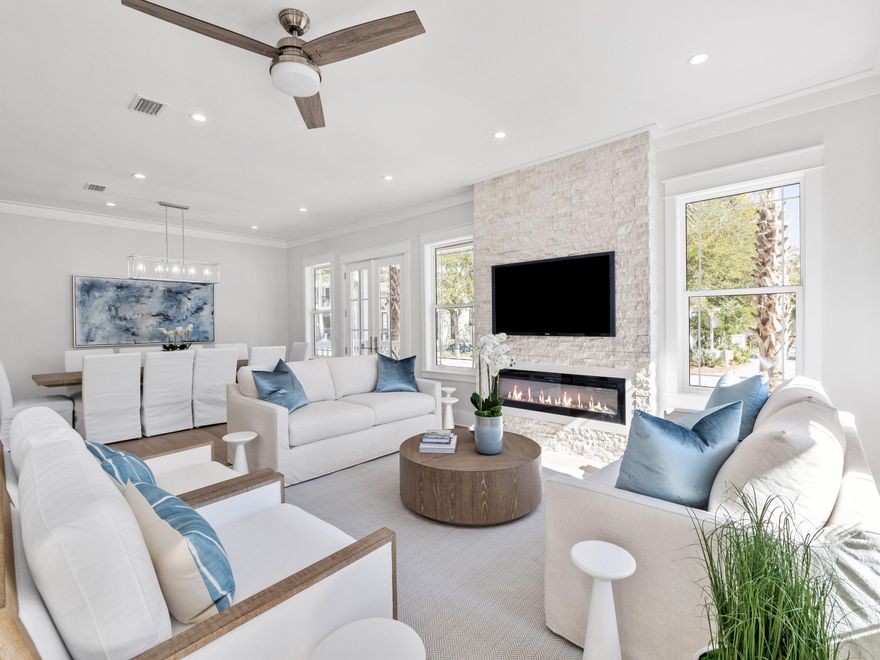 Nestled in the highly sought-after community of Seacrest Beach along the picturesque Hwy 30A, this exquisite newly constructed beach house is a true gem, being offered fully furnished for your immediate enjoyment. Boasting 5 spacious bedrooms and 5 and a half luxurious baths, this home is a blend of comfort and elegance, featuring stunning wood flooring that flows seamlessly throughout. The layout includes two primary suites--one conveniently located on the first floor and another on the third floor--providing privacy and comfort for all guests. With three inviting living areas, the main gathering space on the first floor is perfect for relaxation, complemented by a charming fire feature that adds warmth and ambiance. Ascend to the second floor to find a second living area, along with a sprawling covered outdoor living space, ideal for entertaining or simply soaking in the coastal breezes. The heart of the home, the open kitchen, captivates with its modern shaker-style cabinets, gleaming tile backsplash, and top-of-the-line appliances, sure to please any culinary enthusiast. Just outside the kitchen, you'll discover a beautifully designed wet bar, complete with open wood shelving, a wine refrigerator, and an ice machineperfect for hosting gatherings. Enjoy the fresh air and tranquil views from the porches attached to three of the five bedrooms, and relax on the two expansive porches off the first-floor living and kitchen area. Conveniently located, the Seacrest Beach shuttle picks you up right outside your door, whisking you off to the mesmerizing beach. Start your day with a delightful breakfast at a charming caf?? in the neighborhood, or explore the delightful options for dining, boutique shopping, and entertainment just a few blocks away in Rosemary and Alys Beach. Revel in leisurely strolls along the stunning white-sand beach or try your luck at fishing. Golfers will appreciate being just minutes away from the well-regarded Camp Creek Golf Club. For those who love nature, Camp Helen State Park lies to the north, offering a stunning natural environment rich in outdoor activities such as birding, hiking, kayaking, and fishing on the serene Lake Powell.