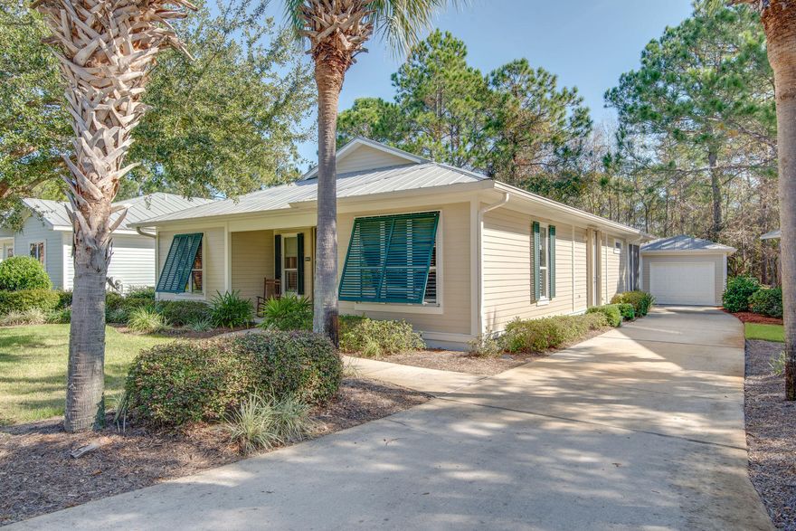 Open House Nov 23rd 10am-1pm! Charming single story cottage with a garage. This home is nestled along the wooded conservation offering a serene, natural backdrop view. Enjoy a wide kitchen with a rolling island, hanging pot rack, stainless steel fridge & dishwasher, smoothtop stove, breakfast bar open to the living area and double walk-in pantries (one currently used as an owners closet). Off the living area are 2 spacious guest bedrooms, each with ensuite baths. There is an additional 4th bedroom connected to the back screened porch. Relax in your spacious master suite with a walk-in closet, dual sink vanity, walk-in shower and access to the screened porch. This home is equipped with hurricane shutters, new 2017 HVAC and 2 new 2019 water heaters for that extra peace of mind.