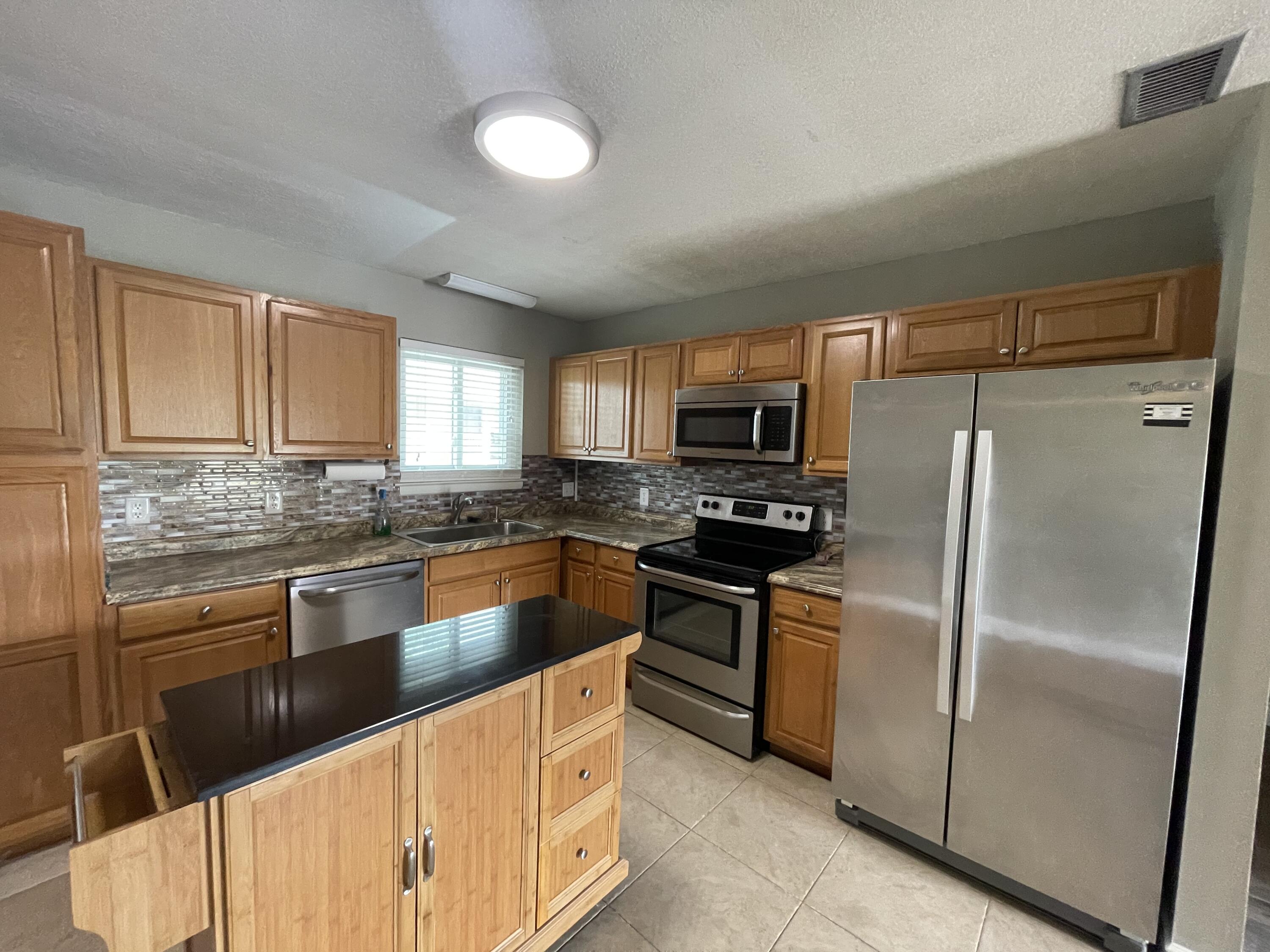 Completely renovated condo in a great locations. Large open kitchen with stainless steel appliances and elegant glass tile backsplash. All wet areas have tile flooring, New LVP throughout all other areas. Community pool just a short walk away. .Water, trash and pest control included.