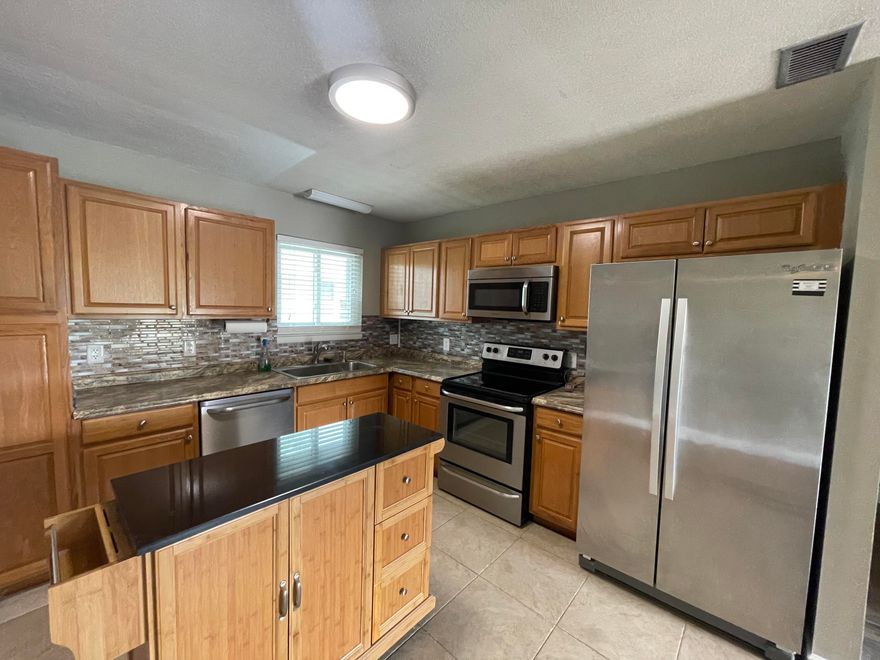 Completely renovated condo in a great locations. Large open kitchen with  stainless steel appliances and elegant glass tile backsplash. All wet areas have tile flooring, New LVP  throughout all other areas. Community pool just a short walk away. .Water, trash and pest control included.