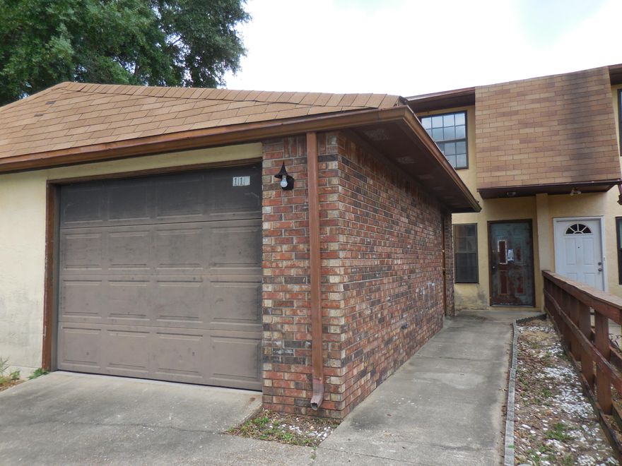 REO. Fannie Mae HomePath Property. Great Opportunity for a townhome with a garage!! This 3 bedroom, 2 and 1/2 bath home also features a balcony that looks out over the common area. The living room combo dining room open to a secluded , partially covered back patio. The kitchen features several pantries. You also have the choice of using the original outside attached laundry room or the newer one located in a section of the kitchen. The 1 car detached garage is a wonderful bonus.