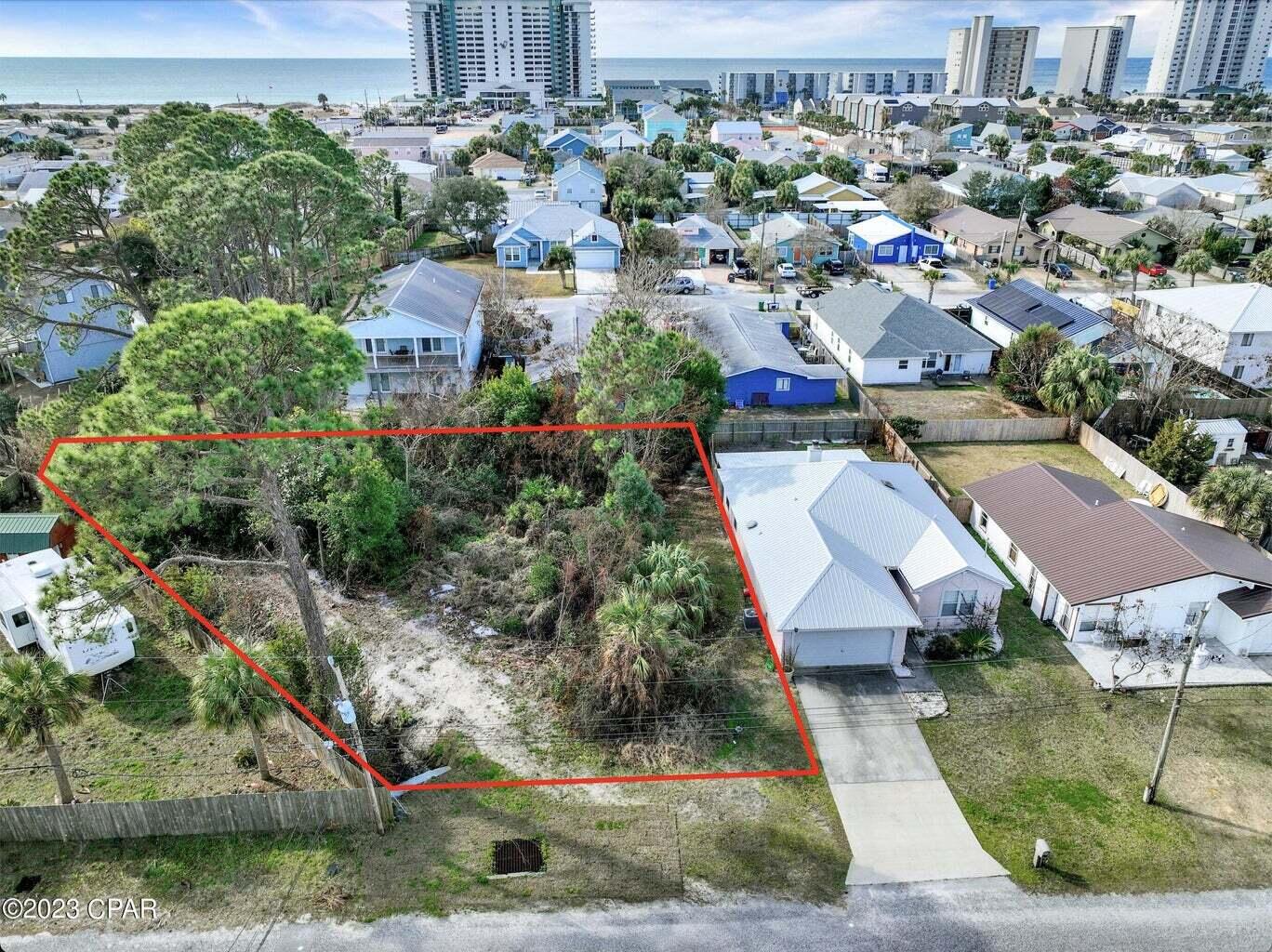 BUILDERS & INVESTORS! Survey Confirmed 0.273 Acres! Now is your opportunity to buy one of the last remaining vacant lots in the area. Located between the Grand Lagoon & the the Gulf of Mexico. Perfect location to build a new beach home or income producing investment property/vacation home rental. Residential Zoned R-3 Duplex/Triplex/Quadraplex Confirmed with Bay Co. No HOA! Walking distance to Public Beach Access on the Gulf of Mexico is 0.7 miles; Driving Distance to St. Andrews State Park is 2.9 miles; Dolphin Boat Ramp is 528 yards away. Electric & water utilities available. All measurements are approximate so please verify if important. 10/2022 Bay County performed maintenance on drainage ditch easement along east side of property fence line.