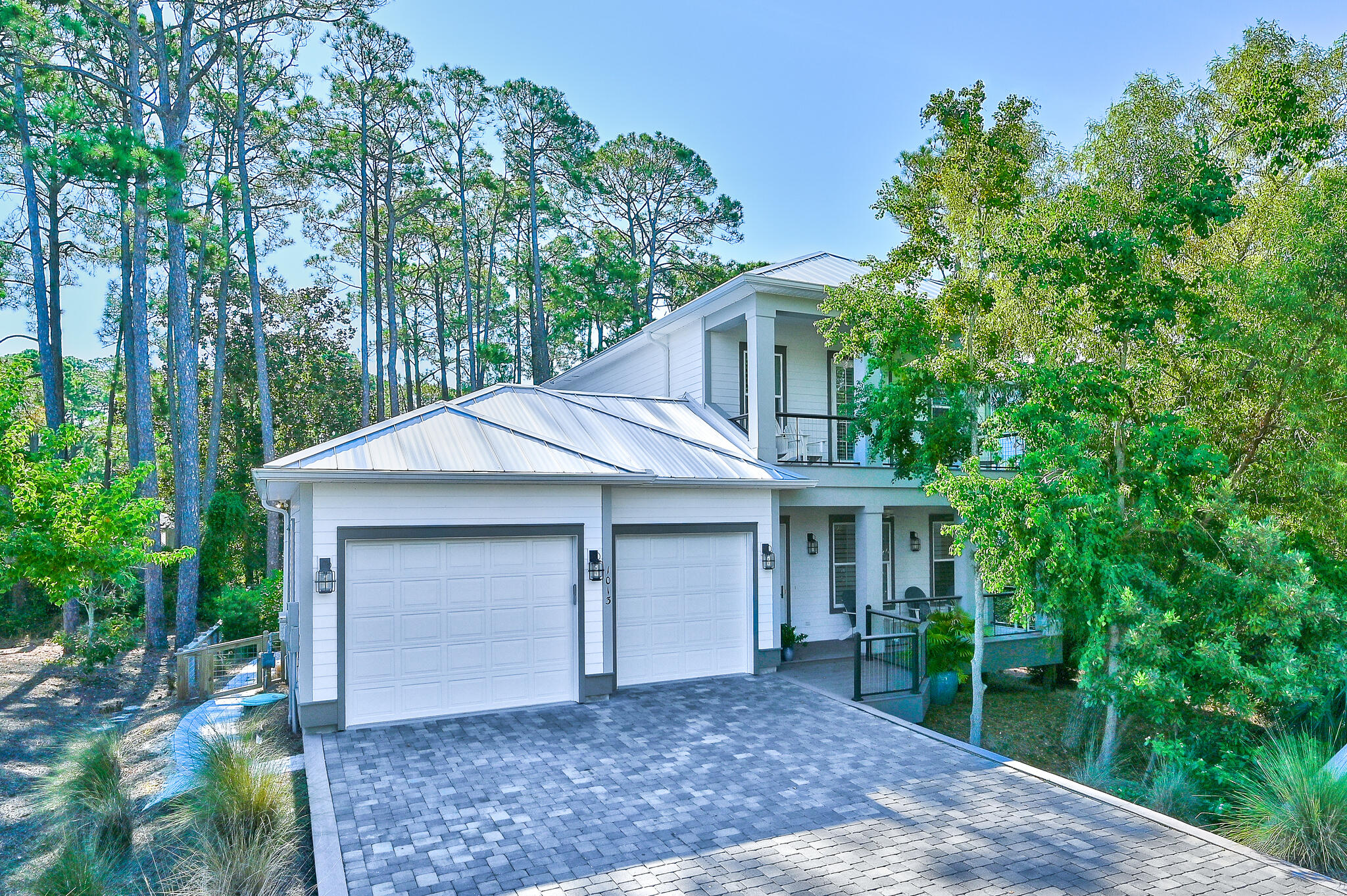Rare opportunity to own this 4 bedroom, 5 bath, 2 car garage high end home just steps to the Dune Allen Beach access. This home features an open concept living plan with first floor primary bedroom, ensuite bath and large walk-in closet. Kitchen features gourmet stainless appliances and granite countertop. A wet bar has an icemaker. Spacious dining area and the primary bedroom opens to a secluded screened in porch. The second floor has another primary master ensuite which opens to a covered deck. There are two other ensuites bedrooms each with walk in closets. This home offers outdoor living at it's best! Enjoy the masonary, wood burning fireplace or settle into the wonderful hot tub while listening to your favorite music.