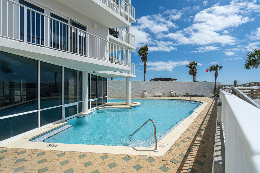 Price drop! Do not miss this one--see it now! Situated on the Gulf of Mexico, this 2 bedroom, 2 full bath condo is perfect for your next holiday. Convenience is essential with an assigned covered parking space for you. It's a short walk to the Gulf to enjoy the sandy white shore and emerald water. Indulge in this property's luxurious amenities: a heated indoor pool, an outdoor pool, a gym, barbecue grills, and a picnic table. Whether you want to relax or stay active, this condo has something for everyone. This property can be short-term rented, so schedule your tour today!