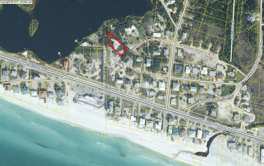 Beautiful Gulf and Lake Views! Large Private lot (.35 acres.Approximately 15 yards from the Gulf.High and dry on an X flood zone, no wetlands and partially cleared. The perfect place for a beach home!