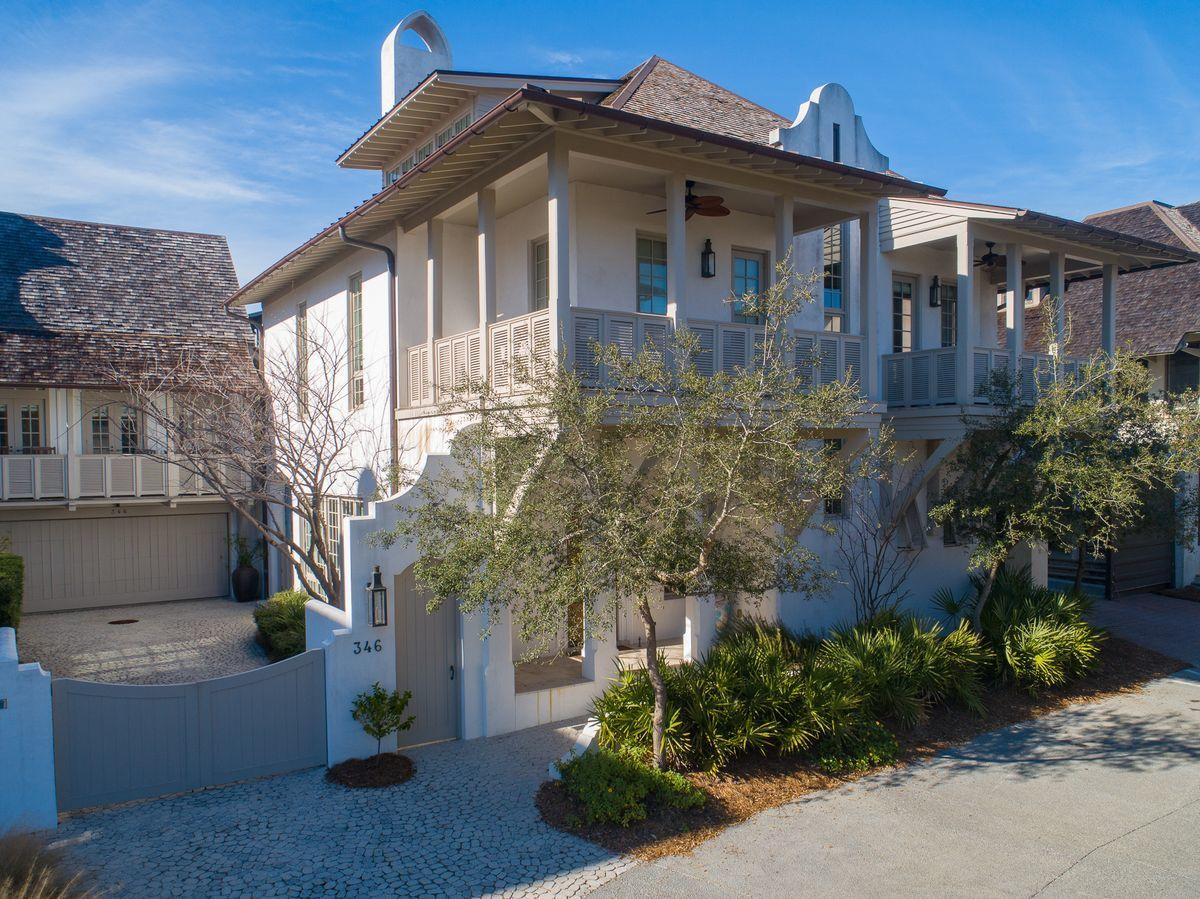 Forwardly designed and masterfully constructed, this quintessential home is nestled within one of the most iconic corners of Rosemary Beach. An elegant architectural wonder positioned steps away from the sugar white sand of the coast and the sea blue green of the Gulf of Mexico, 346 W Water Street enjoys its flow from interior living to the spacious courtyard.The home inspires through masterfully crafted details including Venetian plaster walls, pecky cypress columns and beams, masterful Groin Vault ceilings and oversized windows. The interior and exterior fireplaces provide exceptional gathering spaces to contemplate the day ahead or unwind from a day at the beach. As one enters through the arched hand-carved teak front door, the crisply designed living space welcomes!