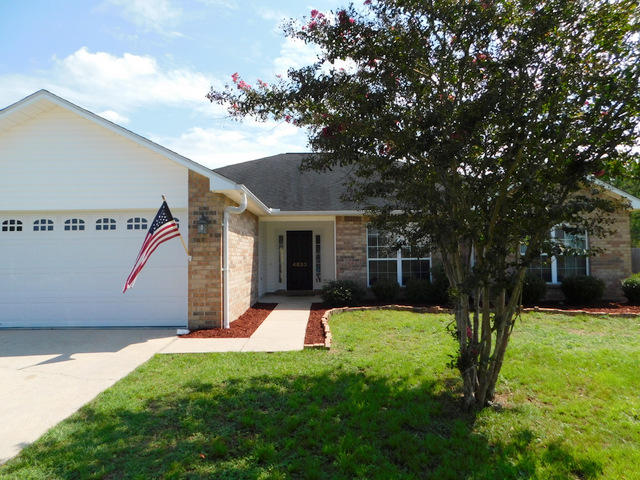 PRICE REDUCED !! South of I-10 with a convenient commute to the bases, beaches and shopping. This all brick, 4 bedroom home is located in a very low traffic area, has an extra large back yard with privacy fencing and a yard building. Inside, there are nice wood laminate floors, an open floor plan, corner, Gas fireplace, vaulted ceilings, newer upgraded fixtures and a large kitchen open to the semi formal dining room. If you are looking for a great home on the south side of Crestview for easy access and want a large lot for room to run, take a closer look at this home before it is SOLD. This home also comes with the extra piece of mind that is being provided by the sellers that are offering a one year home warranty at the time of closing.