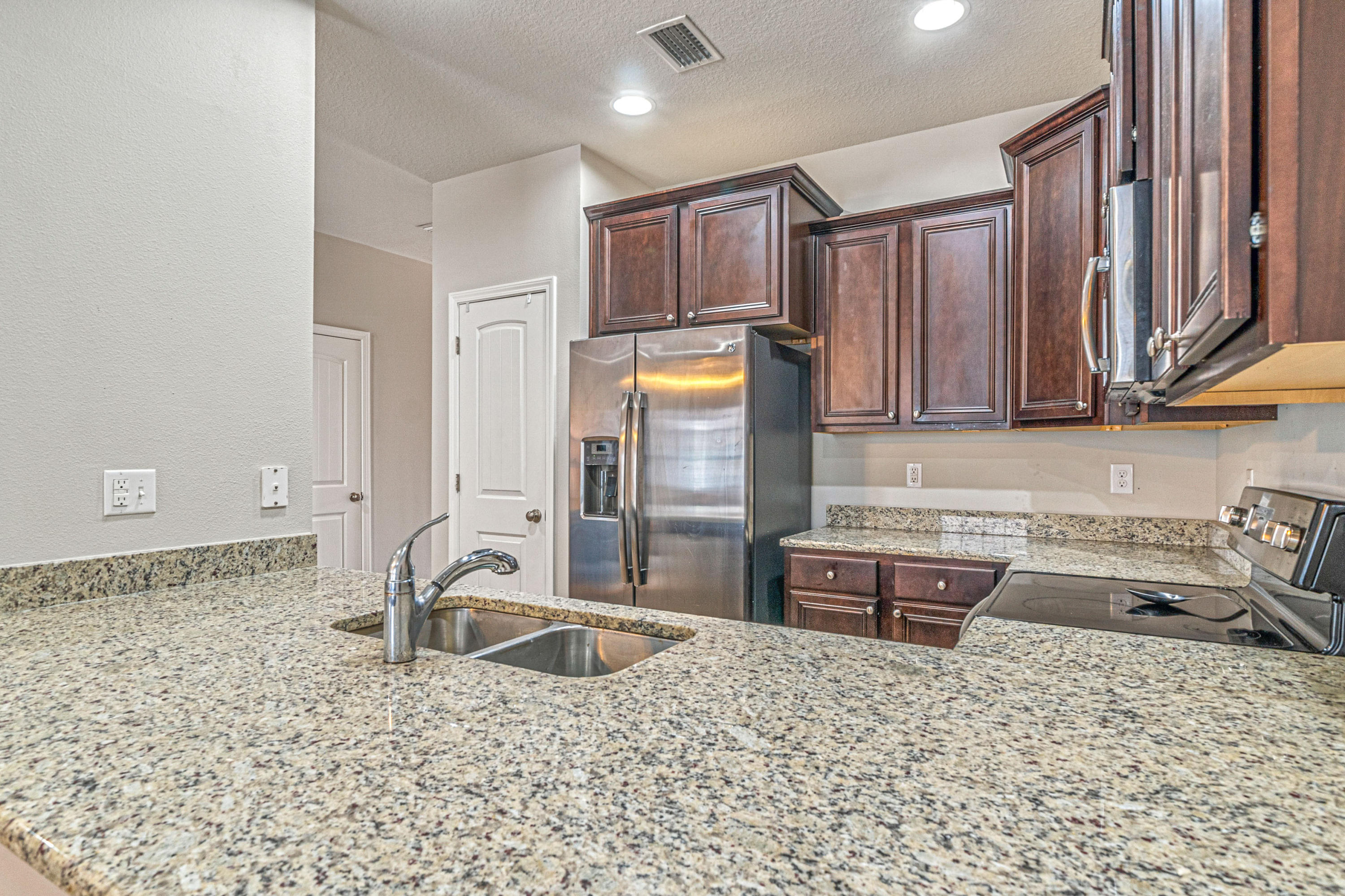 Welcome to this fabulous 3 bedroom 2.5 bathroom townhouse located in East Navarre. This unit is in the back of the complex conveniently located by extra parking. As you enter the home you are greeted by stylish wood look laminate flooring. The kitchen boasts granite counters and staggered dark cabinetry. The back yard has a privacy fence perfect for your favorite pooch! Upstairs there is a spacious master suite with a large bath attached along with two additional bedrooms and another full bath. This home is close to beaches, shopping and so much more!