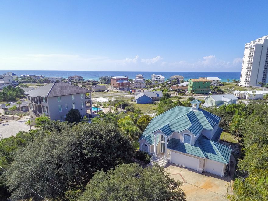Accepting Back Up Offers! $24k below appraised value. Sitting high above the beach gulf views unfold before you. Enjoy the privacy of living in Gulf Pines, a quiet beach neighborhood in Miramar Beach, where the beach is always beautiful and never crowded. This four bedroom custom built beach home sits on one of the highest points in the neighborhood. The Living Room with fireplace and built ins features a soaring ceiling and large window allowing the room to be flooded in natural Florida sunshine. The comfortable interior spaces encourage gathering as well as places of solitude. The family room, kitchen and breakfast room are graciously sized and overlook the outdoors. The breakfast nook and living area lets on to a screened porch for Florida to expand the living area. There is over 600 sq. ft. of outdoor spaces The spacious Master Bedroom Suite is conveniently located on the first floor. The Master Bathroom boasts a double sink vanity, water closet, separate shower and large soaking tub. The additional guest bedrooms are located upstairs for maximum privacy. Two of the guest bedrooms access a balcony for sunbathing, taking in the beautiful views of the Gulf of Mexico or star gazing on a moonlit evening. This home features an oversized 650 sq. ft. attached garage for two cars and a golf cart with ample space for all of your beach toys. 
Few neighborhoods like this exist along the Emerald Coast. The beach is never crowded with approximately 1,300 feet of gulf front, and there is common access area to the lake, which is perfect for fishing. You will enjoy private beach access and the Gulf Pines neighborhood has a large common area gulf front pavilion on 100 front feet of beach for enjoyment. Neighbors gather to toast the sunset at the beach pavilion. Golf carts are one of the main modes of transportation in the community and there is ample parking at the beach for your golf cart. Gulf Pines is nestled between two resorts and is conveniently located near the Emerald Coast's finest dining and shopping. You are minutes from Silver Sands Premium Designer Outlet, Grand Boulevard, Market Shops and Baytowne Wharf at Sandestin and ten theatres at Grand Boulevard. A hospital and medical offices are nearby as well as grocery stores, golfing and tennis. We invite you to see this home that is offered by the original owner and has never been on a rental program.  $84k+ Rental Projections.