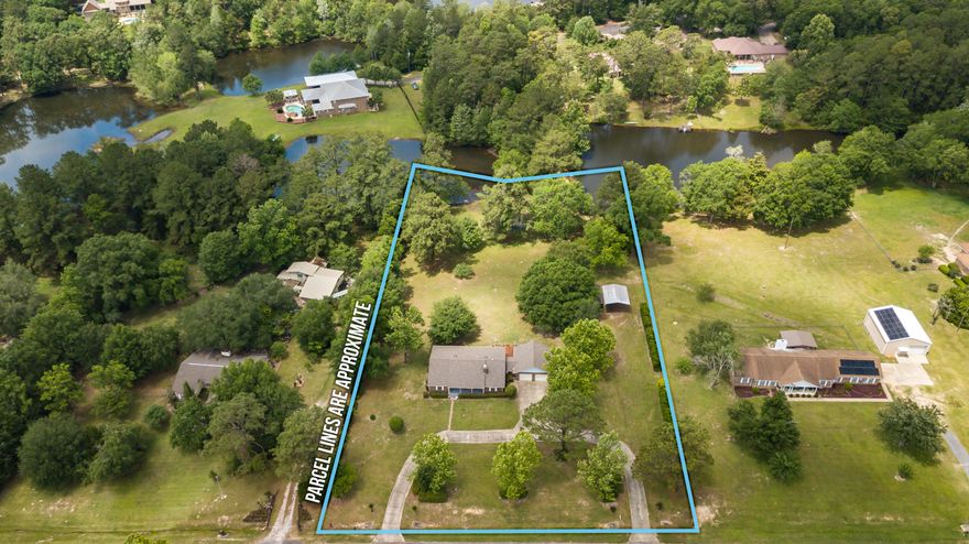 What is better than having a lake front home? How about having 2 lakes to enjoy and unwind at the end of a long day by sitting down with beautiful scenery or even throwing in a line and catching a bass!!! This home provides 2.31 acres for your country get away feel but yet does not sacrifice the commute to local schools, beaches, shopping centers and the local bases. There is a 2 car garage attached to the home plus a detached workshop for all your various hobbies. Step into this beauty and right away notice the unique attention to detail trim work, large brick fireplace, and stunning views out the windows over looking your land and lakes. The home has been upgraded and remodeled to include updates include upgraded master bath with jetted tub and double vanities, upgraded hall bath new hot water heater, new A/C unit inside and out with a pure air HALO ionizer installed 2016. Some of the other stunning features are a newer deck for those BBQ nights, a underground dog fence, and much much more. Schedule your showing today!!!