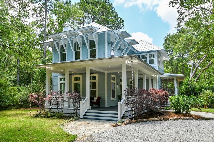 Nestled on approximately an acre of land with grand oak trees and mature native growth is a custom built, three bedroom, three and a half bath home located in Point Washington's desirable community, The Woods. 

The Woods is a private community consisting of large wooded lots, minimal HOA dues, and
a community dock to enjoy gorgeous sunsets and expansive bay views. The community is located due north of Seaside, and is just two minutes from the beautiful beaches of 30A. This home is bordered by two 30' easements and is located at the end of the cul-de-sac, which provides enhanced privacy. With an acre of land, this home offers the option of adding a mother-in-law suite and swimming pool, if you so desire. This 2,640 sf custom home is perfect for entertaining with its open floor plan, wrap around porches, and
home stereo. It boasts of two fireplaces, 10' ceilings on both first and second floors, solid poplar custom
interior doors & trim, long length 5" maple wood floors throughout, and large windows allowing an
abundance of natural light, inviting nature indoors. The chef's kitchen has custom cabinetry, quartz
countertops with a double stainless steel sink, a granite island with a stainless steel prep sink, and
stainless steel appliances which include, an oversized Kenmore Elite side-by-side refrigerator and
freezer, a Kenmore Elite dishwasher, a Kenmore Elite convection oven, and a commercial grade Premier
gas oven and range. The kitchen also features a massive custom built display cabinet and hidden walk-in
pantry.
All three bedrooms are ensuites. The primary suite is its own oasis, located on the second floor away
from the guest bedrooms, overlooking gorgeous mature oak trees. It offers a large bedroom with a
marble fireplace and custom built reading nook, a marble clad bathroom with a large walk-in shower with
dual shower heads, a luxurious 6' soaking tub, double vanities with granite countertops, and a dressing
vanity complete with a quartz countertop and designer lighting. There is also a custom walk-in closet
created by Closets By Design and a separate water closet. Both ensuite guest bedrooms offer walk-in
closets and custom tile in the bathrooms.
This home also offers two bonus rooms currently used as an office and theater room. There is a large
laundry room complete with deep cabinets, a 13" deep stainless steel sink, and granite countertops. Not
to mention 500 sf of attic space. If you're looking for a peaceful retreat away from the hustle and bustle
of today's world, 207 Bay Trace awaits you!