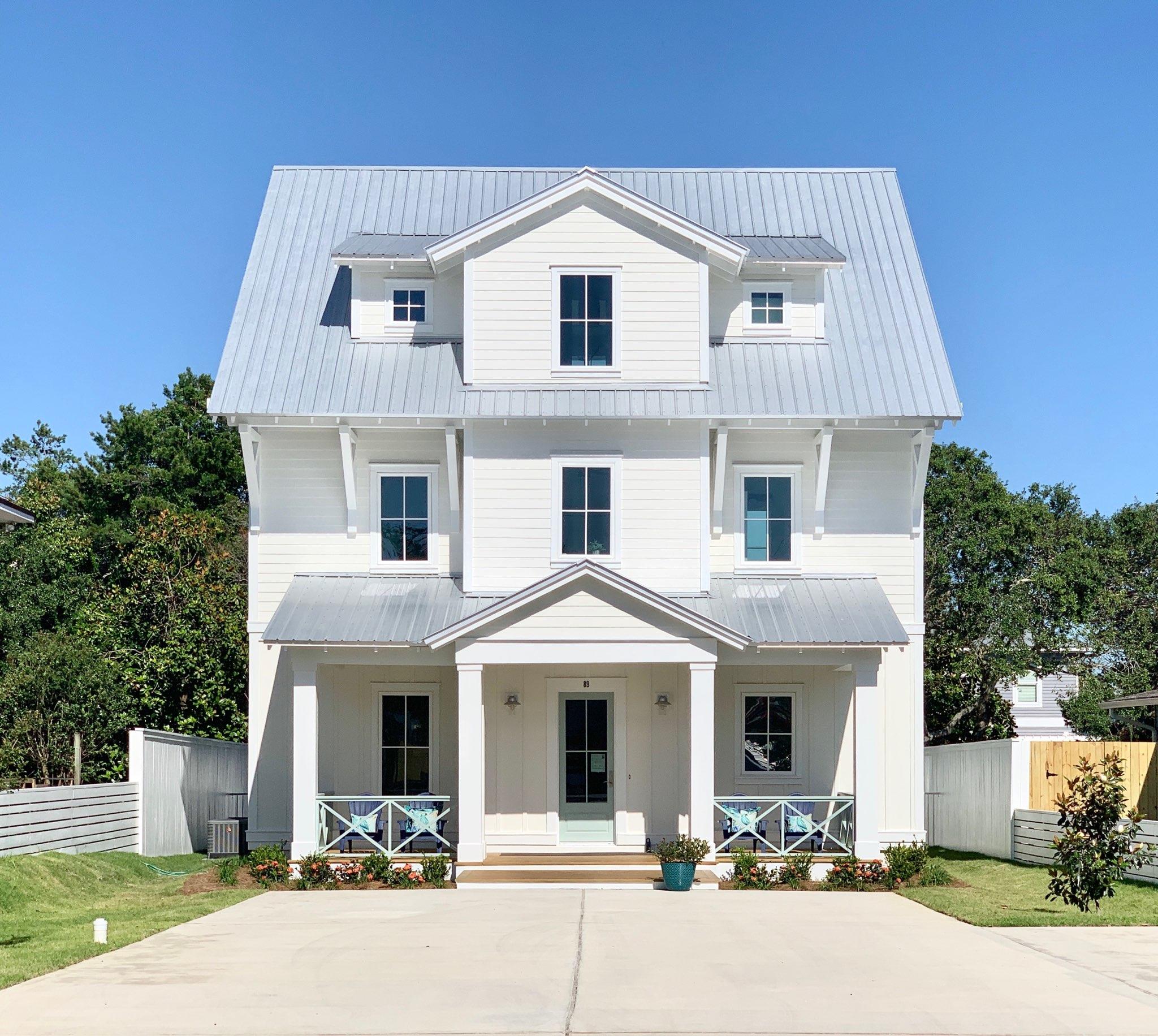 Brand New Custom Built Home in Crystal Beach with Fantastic Rental Potential! Just Steps to the Beach and Perfect for entertaining, the Caribbean blue pool is surrounded by stunning Italian Cypress trees and an over-sized coral stone patio. There are Five Suites including Double over-sized Masters with wet bar, that are adorned with beautifully woven rattan hanging pendants. The kitchen is light, bright, airy, and features timeless GE Cafe Appliances in matte white and brushed bronze, accented by a matte white, retro-inspired back splash. The dining area overlooks the pool and the brick accent wall in the living room. The showers and tubs have detailed tile work and seamless glass doors. The Jeld-Wen Premium Atlantic Windows are Impact Resistant and energy efficient.