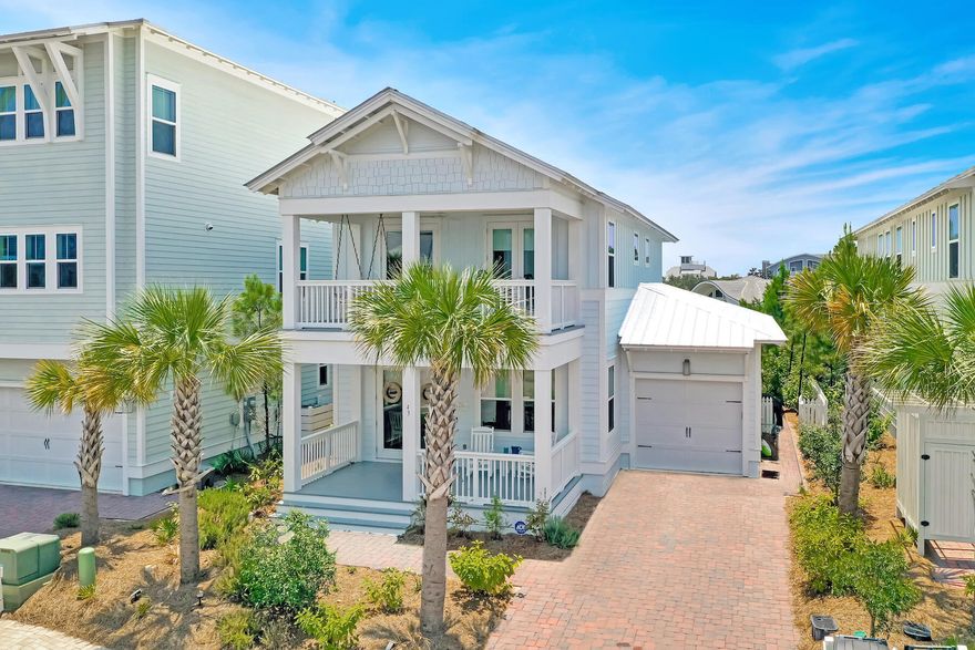 Meticulously cared for, this attractive beach house backs up to a forever green buffer and the Watersound Beach neighborhood. As you approach the home, notice the deep and inviting front porch. A total of three porches provide almost 1,000 square feet for enjoying the outdoor lifestyle in this peaceful part of the community. This light and spacious home has an open floor plan incorporating a living area with shiplap accents and a dining table to seat eight. Engineered hardwood flooring emphasizes the high quality showcased throughout this pristine home. Heading toward the kitchen, three bar stools are lined up at the peninsula for casual dining or pre-dinner drinks. The kitchen has lots of counter space, maple cabinetry, built-in stainless steel appliances and a five-burner gas range with vented hood. The first-floor master suite boasts an immaculate ensuite bathroom paired with a rain head shower, dual vanities and a walk-in closet. The back door leads out to a generous screened porch and a grill area within the fenced yard. A half bathroom, laundry, and storage closets complete the well-planned main level living space. Upstairs there's a king-sized bedroom with an ensuite bath and large walk-in closet. Two more guest bedrooms share the family bathroom and both have direct access to the generous second-floor porch. It's a lovely space to enjoy a cup of coffee or a quiet read on the swing seat. The one car garage offers bike storage and overhead racks. This home has never been rented out but is in a prime location for vacation rentals. Located on the quieter south side of the Prominence neighborhood, it's conveniently close to The Big Chill for dining, shopping and entertainment. With two community pools, a fitness room and the beautiful white sandy beach nearby, it has all the makings of a perfect primary residence or vacation home.