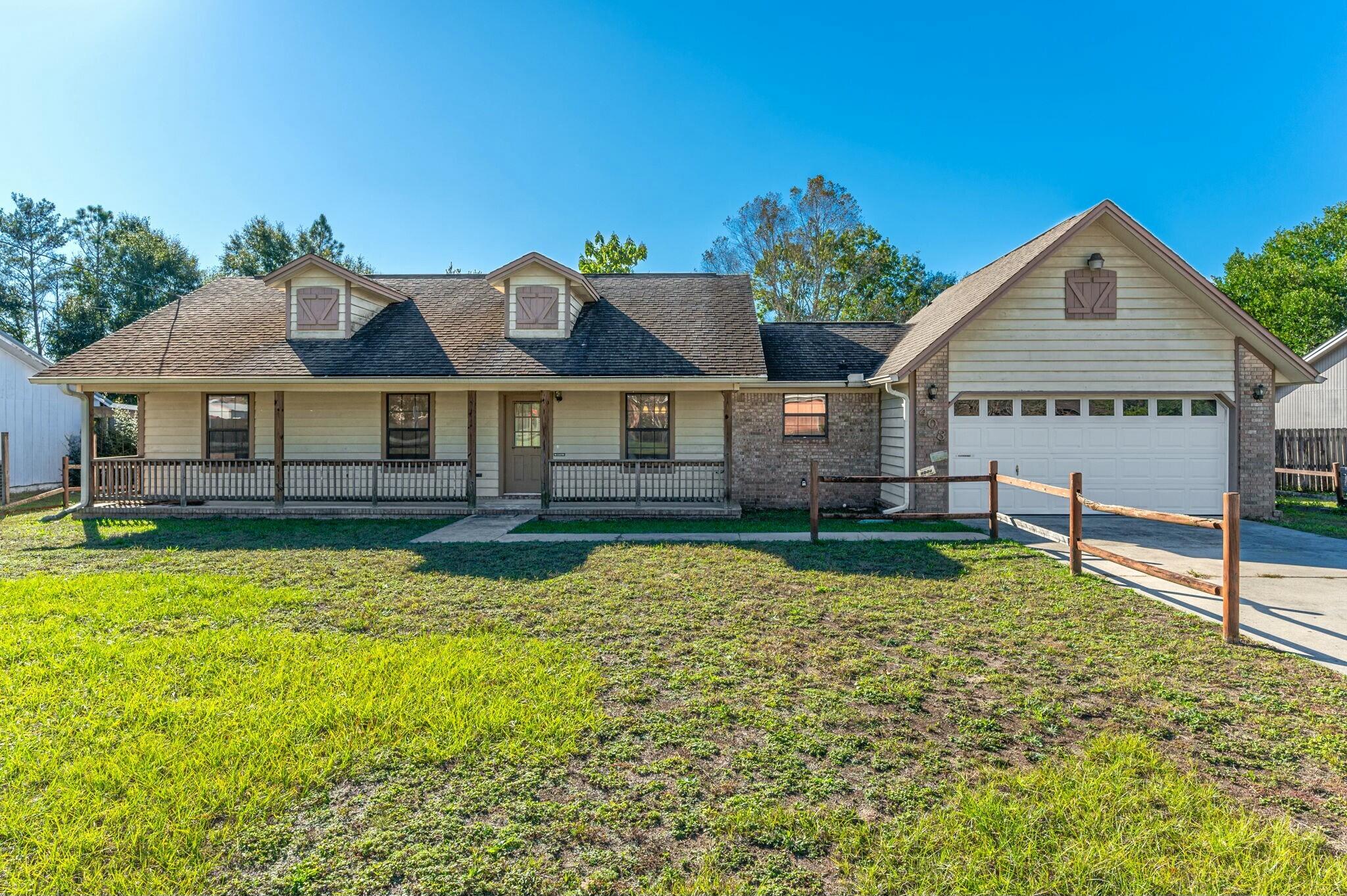 Discover the potential of this delightful 3-bedroom, 2-bath home located in South Crestview! Recently refreshed with a new coat of paint, this home is ready for you to make it your own. Step into the spacious living room, where vaulted ceilings with a stunning wood beam create a warm and inviting atmosphere, complemented by a cozy fireplace perfect for chilly evenings. The kitchen and dining spaces flow seamlessly, offering the perfect setup for family meals or entertaining. Outside, you'll find a large covered back deck overlooking a nice sized yard, ideal for outdoor gatherings, gardening, or just relaxing in your own private oasis. While the home still needs new flooring and a touch of TLC, it's brimming with potential to become the perfect space for its next owner. This property perfectly combines charm and opportunity. Come see the possibilities for yourself and schedule your showing today! **Home is being sold AS-IS and will not qualify for VA or FHA financing**