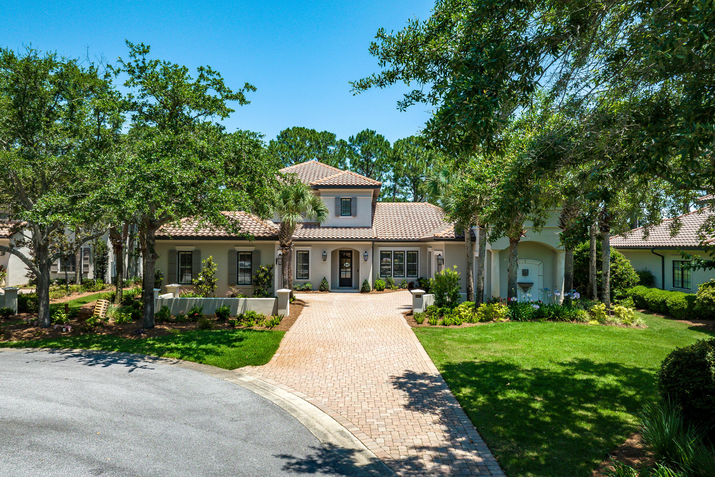This is a SHOW STOPPER! Beautiful 4 bedroom/ 4.5 bath with a large bonus area and mother-in-law quarter, located in exclusive Burnt Pine in Sandestin. This home features an open floor plan with great outdoor living. On the first floor you are welcomed by a cathedral entry open to the second floor then a formal dining room, dreamy kitchen, and stunning living room. The living room opens to the backyard sanctuary with a screened porch, patio, pool and spa, gas fire pit and outdoor kitchen. All of this with lush landscaping overlooking the #2 hole at Burnt Pine Golf Course. The first floor is also where you'll find the oversized primary suite to the East of the kitchen, and one bedroom and a mother-in-law suite that was converted from the 2nd garage, on the West end (note: this garage can easily be converted back to a garage). The second floor has a large additional living space, breezy balcony overlooking the golf course, and two more bedrooms each with their own bath. The entertaining areas in this home are abundant and are sure to allow for many family gatherings, holiday get-togethers, and relaxing nights outdoors with friends. The property offers lots of privacy, being on the cul-de-sac, and also provides extra parking when needed. All of this AND a ton of recent updates: New pool pump and heater, pool resurfaced and new spa coping, new water heaters, new washer/dryer, new duel fuel range by Fisher and Paykel, reserve osmosis system in kitchen, new kitchen backsplash, exterior painted in 2022, new outdoor kitchen and grill, new built-in icemaker, new fireplace facing and logs, and various upgrades to light fixtures and hardware. Also, there is great storage above the garages. Don't wait too long as this one is priced right!