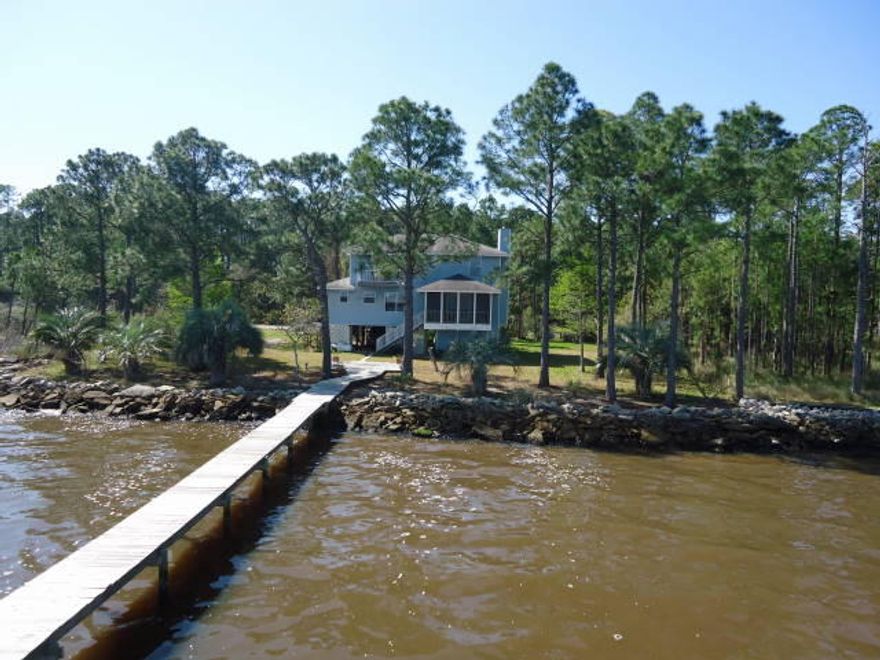 Quiet, peaceful and private describes this 2194 sq. ft. bayfront beauty with 3 Bedrooms 2.5 Baths, dock and boatlift that is only minutes away from some of the best shopping, restaurants, schools and the beautiful beaches of South Walton. Views from every room, fireplace, screened porch, extra storage and covered parking. Room and lot dimensions are approximate and should be verified by Buyer or Buyer's representative.