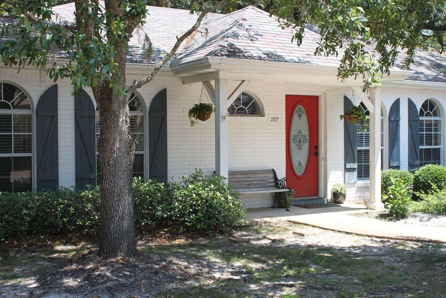 Recently updated adorable white painted brick Florida cottage off Indian Trail tucked away on a brick paved road across the street from Choctahatchee Bay. Conveniently located minutes from the beaches and Destin's best shopping and restaurants. Shaded by beautiful magnolias and oaks, this low maintenance livable home has a car carport and storage room. The inside will delight you with a cozy gas fireplace, built-in entertainment center and vaulted ceiling. The kitchen has a long breakfast bar and is open to living area, so the cook can join in the fun. Chef's will love the gas stove, large pantry and ample counter space. GE appliances include stove, dishwasher, built-in microwave, and refrigerator. The master bath features a walk-in shower with glass door and high vanity.