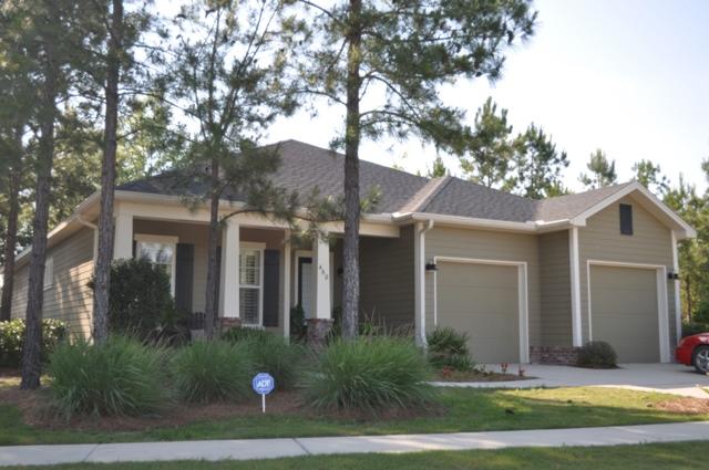 Meticulously maintained Custom Built home in Passages at Hammock Bay. Constructed by exceptional homebuilder, Huff Homes. The level of finish is exceptional, and not what you will find in the production built homes within Hammock Bay. With 10' ceilings this well designed, 2,094sf, floor plan offers three bedrooms, two baths, with office in an open and functional floor plan. Custom built-in entertainment center featured in the great room, with tile floor throughout the living and wet areas. The open kitchen features granite countertops, stainless steel appliances and plenty of cabinets and counter space. Dining room displays beautiful, box trim wainscoting. The master bath features dual vanities and a large soaking tub. Large tile shower, makes this master bath a luxurious oasis.