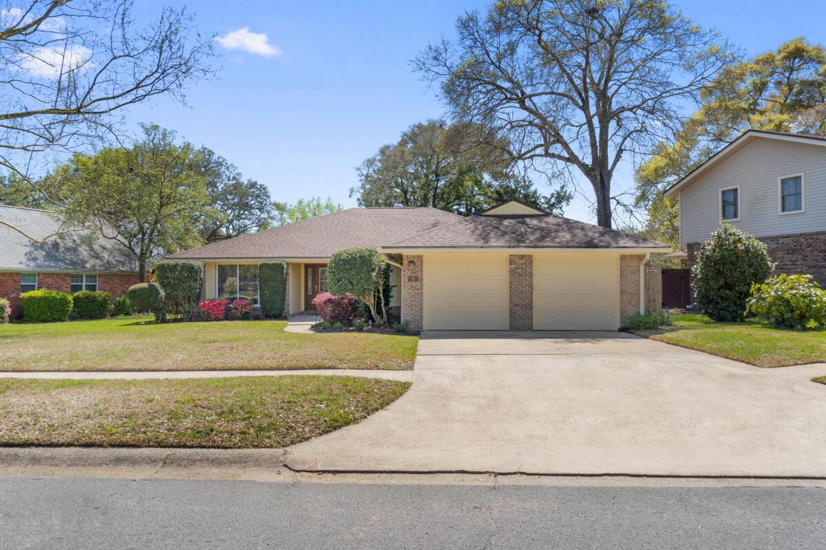 Located in the highly sought-after Kenwood neighborhood, this beautifully remodeled three-bedroom, two-bathroom home seamlessly combines comfort and convenience. Its prime location near both Air Force bases makes it an ideal option for families and military personnel. The spacious open floor plan offers ample storage, while the screened Florida Room overlooks an expansive pool and generous patio area. Recent updates include a new roof, HVAC system, and flooring. Additional highlights of the property include a two-car garage, gas fireplace, completely renovated kitchen featuring stainless steel appliances, a washer and dryer (included with the home) and a natural gas grill.