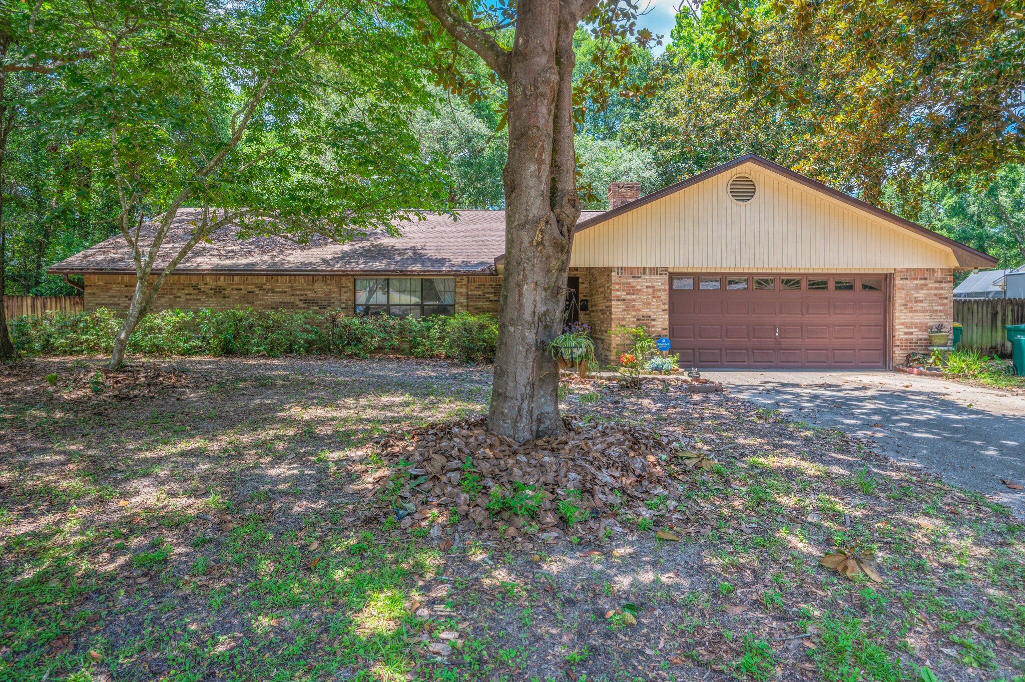 Welcome to your next home in Rocky Bayou!Discover comfort, space, and charm in this beautifully maintained 2,249 sq. ft. all-brick home, located in the highly desirable Rocky Bayou neighborhood--just minutes from everything Niceville has to offer. Enjoy peaceful walks to the nearby community park and the convenience of shops, schools, and amenities close by- including easy access to the Mid-Bay Bridge and Eglin AFB.As you step through the front door, you're greeted by a welcoming foyer--perfect for dropping your keys and bags, with a spacious closet for storage. To your left, the living room features vaulted ceilings and a warm, inviting atmosphere that flows seamlessly into the expansive dining area, ideal for gatherings with friends and family. From here, large sliding glass doors lead to the star of the home: a generously size screened-in porch, perfect for enjoying morning coffee or evening relaxation year-round.
The oversized primary suite offers a private retreat, complete with a walk-in closet, en-suite bathroom, and direct access to the porch through another set of sliding doors. Just off the dining area, the kitchen truly sits at the heart of the home - featuring a breakfast bar, ample cabinetry, and a window overlooking the serene, wooded backyard.
Adjacent to the kitchen is the cozy family room, featuring a wood-burning fireplace and flexible space for multiple furniture layouts. And yes- another set of sliding glass doors connects this room to the screened porch, allowing natural light to pour in and giving the home a wonderful indoor-outdoor feel.
Down the hallway, you'll find three additional bedrooms, a full bathroom, and three hallway closets, offering plenty of storage.
Built in the 1980s, this home showcases sought-after features that are rare in newer builds: abundant closet space, spacious bedrooms, multiple living areas, and a solid all-brick exterior.
Outside, the .78-acre lot provides endless possibilities - whether you envision a pool, outdoor kitchen, garden, or just room for kids and pets to play. The backyard is currently wooded, ideal for nature lovers or future plans like treehouses and forts.
________________________________________
Additional Highlights:
Original owner
Gutters replaced (2025)
Roof (2020)
HVAC (2004)
Hot water heater (2014)
With just a few modern updates, this home could truly shine. Come see the potential and make it yours!