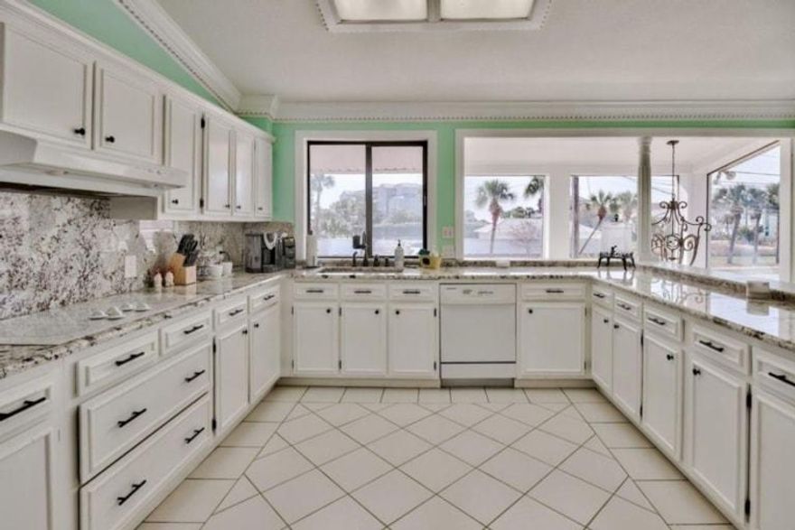 Accepting Back Up Offers.  Incredible Panoramic views from this Superb Waterfront Townhome with  Boat Slip/Lift located on the Exclusive Destin Harbor.  Conveniently located in the Heart of Destin on Holiday Isle. This Multi-Level Townhome is Perfect for Living your Dream on the Water, Use as a Vacation Home, or a Phenomenal Rental Income Machine doing over 90k a year in short term rentals! Dock your boat right in your backyard in your own private boat slip and New 16,000lb Boat Lift! You are less than 10 min. to Destins East Pass, the Gulf of Mexico and Crab Island! In Season, Destin Water Taxi can pick you up at your back dock and deliver you to all of the Harbors Waterfront Restaurants/Bars and HarborWalk Village! Currently being used as a Vacation Rental sleeping 11 people. This 3Bd 3.5 bath Beauty is Rental Ready or Waiting for you to make it Home! The spacious great room is perfect for entertaining with its expansive views, wet bar and adjoining powder room. New Vinyl Flooring was installed in 2020 throughout and entire interior was freshly painted. New HVAC installed in 2020. All high end furnishings were purchased in January of 2020 as well.  Large, fully equipped kitchen with lots of cabinets, granite counter tops and breakfast area. Brand New Refrigerator & Microwave added less than a year ago. The Master Suite shows off its new ceramic wood planks lovely. Each bedroom is roomy and has an adjacent bathroom while the lower level master suite is waterfront and has direct access to the covered patio and dock. Sit outside and enjoy watching all the boats go by, weekly firework shows over the harbor in the season, and marvel at some of the most spectacular sunsets from your back dock. The spacious second level balcony offers hours of entertainment and expansive views across the Harbor. There is even a small fenced in area to the side of the home to let your pets run. This Gem is only a couple blocks walk to the Public Beach Access! Have your toes in the Sand and viewing the Most Gorgeous Emerald Waters Destin is known for in minutes! Short term rentals allowed