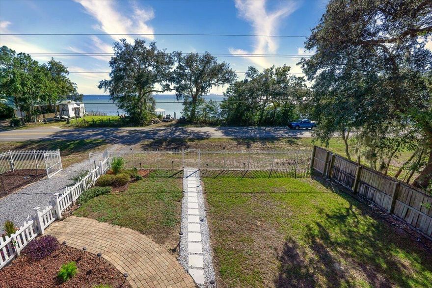 This home is an absolute Dream Home and is so stunning!  Over $250k in renovations in 2020! The Location is so convenient it is located approximately 3 miles to mid-bay bridge, shopping, dining and close to both bases! This beautiful Victorian home has 4 bedrooms and 3 full baths and the natural light illuminates throughout and nearly every room has a view of the bay. High ceilings, triple crown molding, detailed trim, Fireplace, Wood floors, Custom lighting, custom tiled bathrooms, custom Kitchen with beautiful Quartz Countertops and soft close drawers! The list goes on and on. The quality, attention and love put into this home is apparent as soon as you walk in the door you will never want to leave! Multiple outdoor living spaces to enjoy the beautiful views of the Choctawhatchee Bay! This home also has Hurricane shutters, 2020 Roof, 2020 HVAC (2 Units) Controlled access gate to enter the property. A beautiful gated entryway with pavers lead you to the wrap-around front porch that welcomes you to relax and enjoy outside living. Septic was pumped in 2020. The detached 2 car garage has lots of storage and space. There is also a separate smaller metal shed on the back of the lot.  