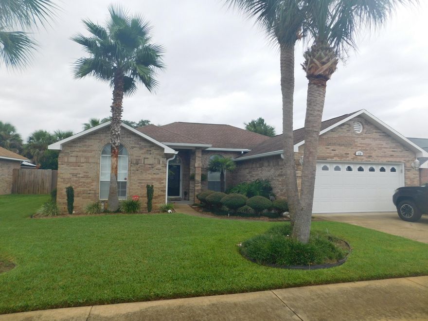 You will be impressed the moment you enter this home. Located only minutes to the Gulf, the bay and Harborwalk, in the desirable Ridge Wood Neighborhood. Roof was replaced 10 years ago, HWH about 4 years ago and HVAC is. French doors lead out to your very own private resort with a large covered patio and custom designed sparkling in-ground pool with cool decking surrounding and a professionally landscaped backyard with palm trees perfectly positioned. Dining area opens into the living area making entertaining a breeze. Spacious living room with 10ft ceilings, crown molding, fireplace with tiled front and custom mantle. Kitchen has been updated with beautiful granite counter tops, lots of cabinets, upgraded appliances to include a new top of the line smooth top stove in the center island,