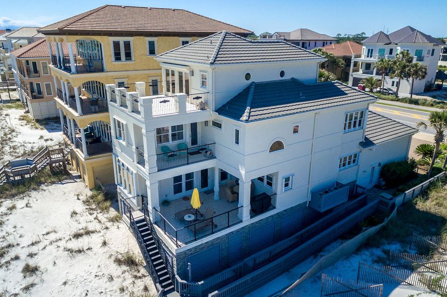 Picture-perfect, meticulously updated Gulf-front retreat boasts timeless design, carefully selected upgrades, and spectacular beach views in prestigious Destiny Shores. Recent enhancements include updated/remodeled baths, remodeled master closet, new lighting design, new landscape architecture, updated kitchen amenities and more. Three stories of beachfront balconies provide ample outdoor living space, while a new walkway and outdoor shower prepare for a day at the beach. Classic but modern design elements like high ceilings adorned with crown molding; custom stained glass in main living areas; new hardware throughout; an elegant fireplace; custom cabinetry; and layers of neutral colors create a serene backdrop to beach views, while arched windows frame miles of artful emerald waters. The gourmet kitchen features a new beverage center, new faucet, and updated cooktop in addition to high-end appliances, a large granite island with breakfast bar, custom cabinetry and beautiful Gulf views. The Gulf-front master suite features a private balcony, morning kitchen, and remodeled walk-in closet. The luxurious, updated master bath includes all new plumbing, double vanities, whirlpool bath and remodeled shower with new marble stone, and a bidet. The renovated third floor guest suite features access to a large, open, Gulf-front balcony, morning kitchen with new refrigerator and granite and completely renovated en suite with new tile, wainscoting, and granite counters. The additional two baths were also recently updated. Extras in this Charlie Clary designed beauty include a wet bar with wine storage off the dining room, hurricane shutters, surround sound audio system, 2nd floor extra laundry center, and workshop and storage area beneath the home. Additional improvements include all new furnishings and window treatments; new alarm system; new sprinkler system; new landscape lighting; new outdoor fencing, fresh exterior and interior paint; added slate front steps and porch; new wash-away walls in faux stack stone and louvers; new stair railings; new solid core doors; new wash sink and cabinetry in garage, one new air conditioner, new insulation in attic above garage; new stone panels and vents on lower level; new tankless water heater, 6 news televisions; and more! This home is sold fully and professionally furnished. 