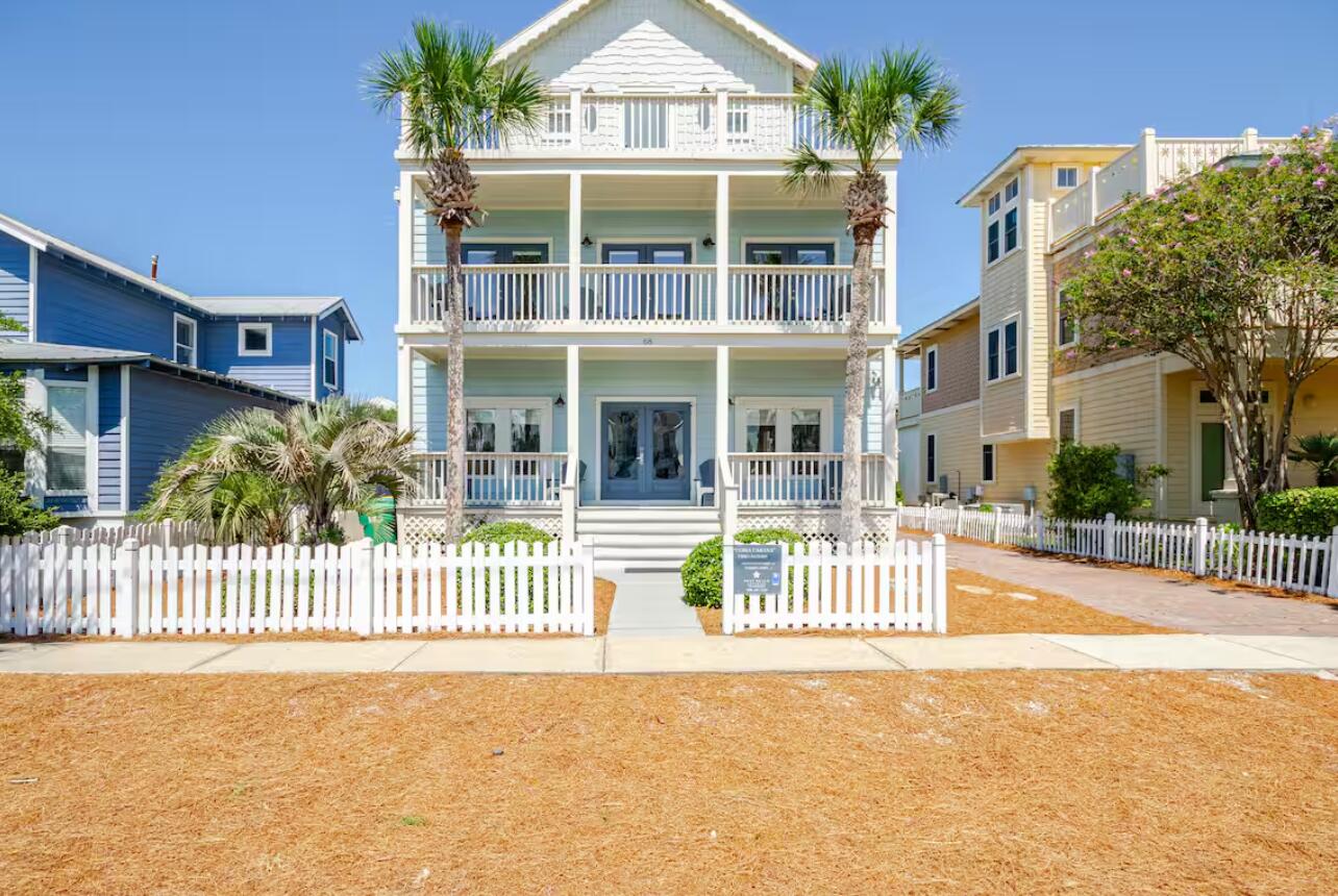 This stunning coastal retreat embodies the classic Florida Beach Style with spacious balconies and breezy porches on all three floors. Just minutes from the beach, the home offers both comfort and versatility with a main house, private pool, and a separate mother-in-law suite complete with kitchenette and its own living space.With 6 full bedrooms and bathrooms in the main house, you have plenty of room for entertaining. With wide-open spaces, thoughtful design, and a location that places you just steps from the beach, this home is the ultimate blend of coastal charm and modern living.