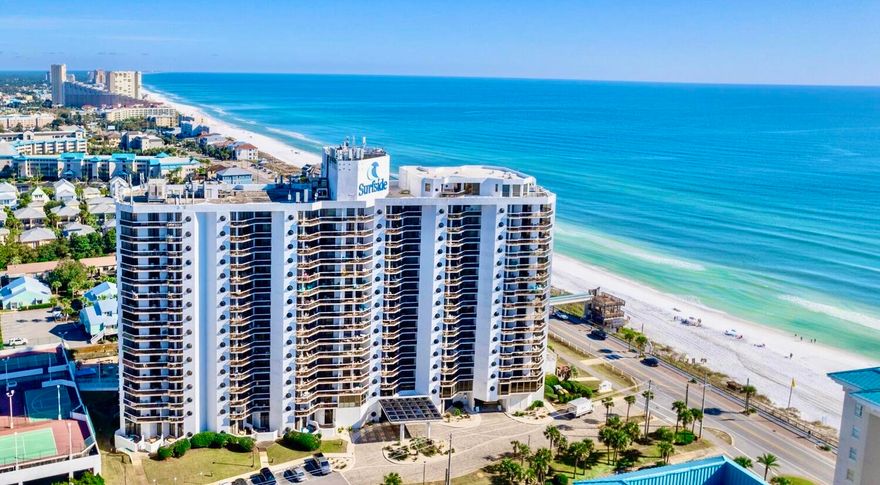 This seventh-floor unit at Surfside Resort features beautiful Gulf views and miles of the eastern coastline! Access the spacious balcony and take in the views from nearly every room in the unit. The split bedroom floor plan features the master suite in the north end, and the guest suite with its own private entrance in the south end. The main living area, dining, and kitchen are the center point allowing for enjoyable recreation and entertainment. The prime location, desirable community, and stunning Gulf views make this unit a fantastic investment property or second home. Surfside Resort offers many amenities including a pool, hot tubs, and spacious pool deck, grilling area, tennis and pickleball courts, fitness center, private beach walkover, and beautiful beachfront. Paradise!