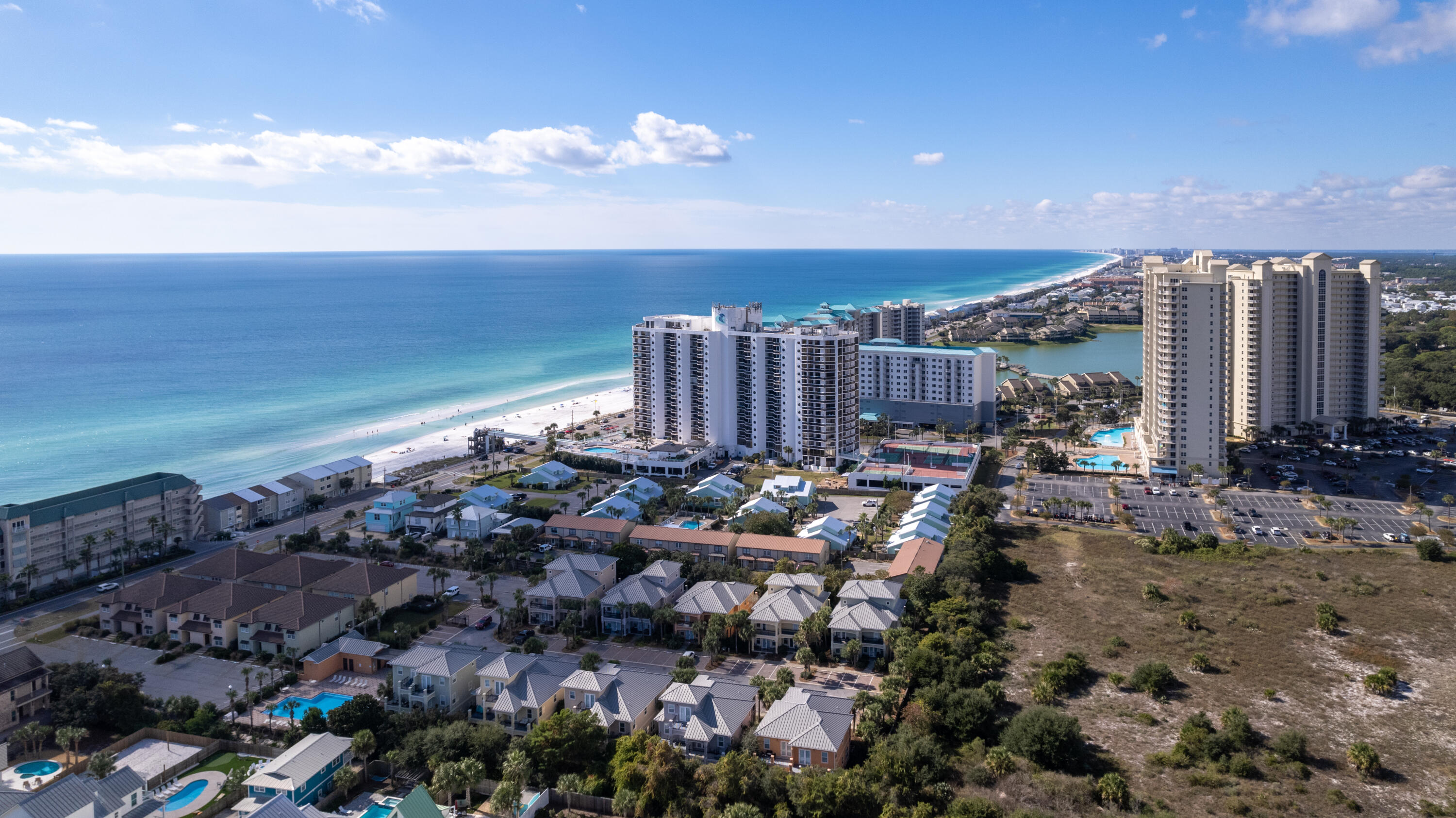 This seventh-floor unit at Surfside Resort features beautiful Gulf views and miles of the eastern coastline! Access the spacious balcony and take in the views from nearly every room in the unit. The split bedroom floor plan features the master suite in the north end, and the guest suite with its own private entrance in the south end. The main living area, dining, and kitchen are the center point allowing for enjoyable recreation and entertainment. The prime location, desirable community, and stunning Gulf views make this unit a fantastic investment property or second home. Surfside Resort offers many amenities including a pool, hot tubs, and spacious pool deck, grilling area, tennis and pickleball courts, fitness center, private beach walkover, and beautiful beachfront. Paradise!