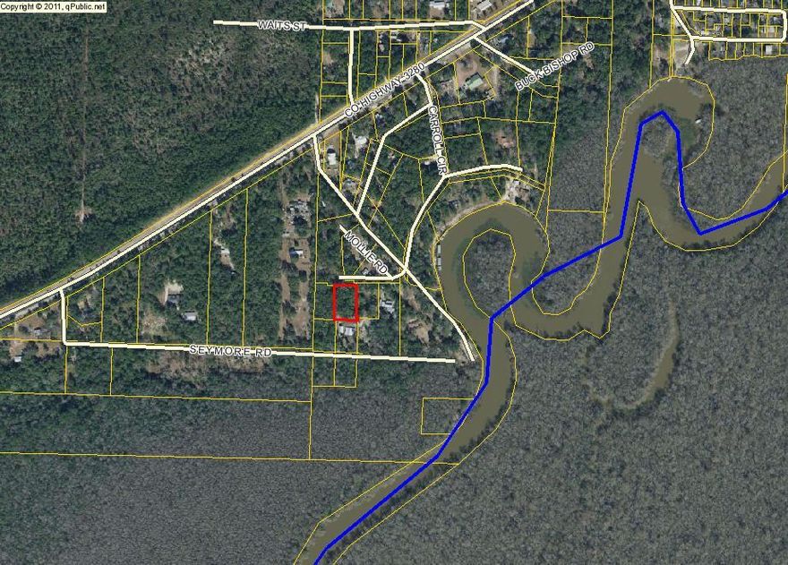 1/2 acre lot near river that would be perfect for weekender place to park an RV or mobile home, or build that dream cabin near fishing!