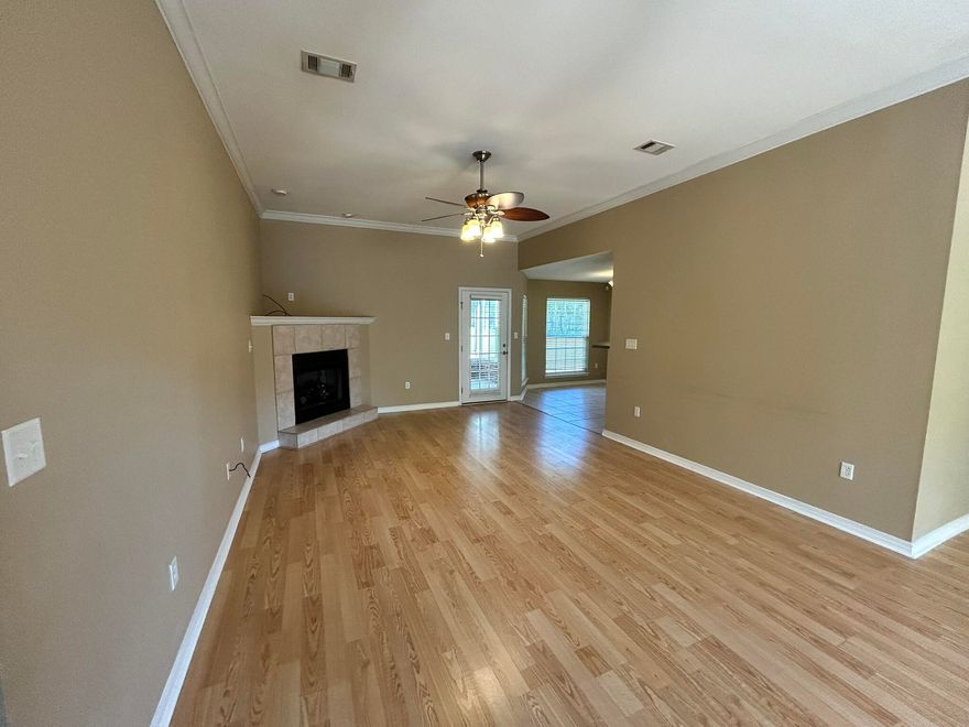3 bedroom 2 bath with spacious yard for entertaining. The living room boasts a beautiful fireplace and has plenty of room for your furniture. Chef's kitchen with it's stainless steel appliances and breakfast bar. Split floor plan with tile in the wet areas, laminate flooring in the bedrooms and hallways! Laminate in the living room as well. Come see this one today!!