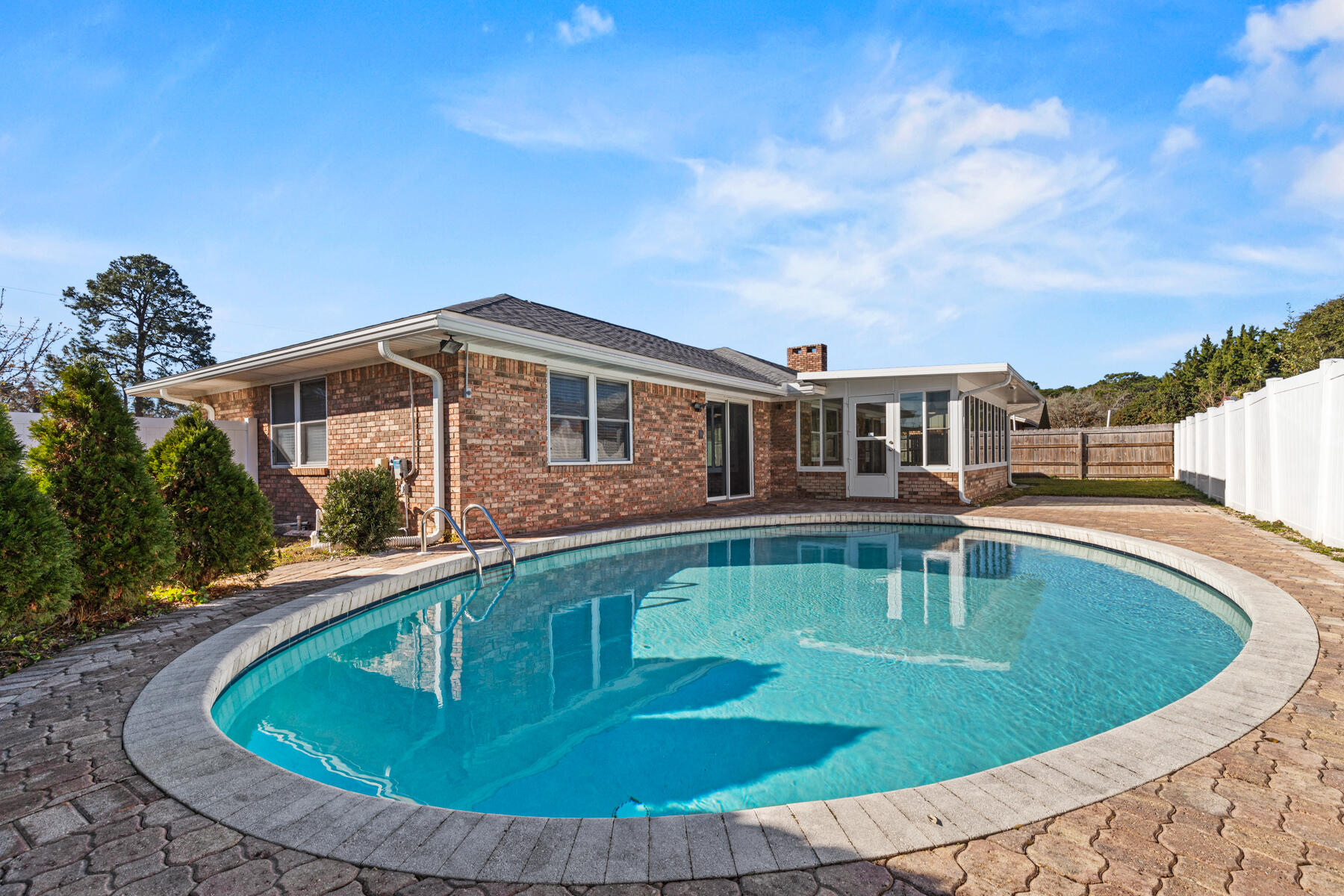 WOW! BEAUTIFULLY RENOVATED BRICK POOL HOME IN FWB! CURB APPEAL STARTS WITH LONG PAVER DRIVEWAY, SIDE ENTRY GARAGE, 2021 ROOF AND SCREENED FRONT ENTRY PORCH. Upon entry you are greeted into the 1ST OF 2 LIVING AREAS that boasts a direct pool view through sliding doors & newer wood plank tile flooring (throughout house). The KITCHEN AREA invites you through the dining area which is complimented with a long granite wet/coffee bar counter w/custom cabinetry from floor to ceiling and chandelier light. Main KITCHEN is adorned with Custom cabinetry, Soft close drawers, 2020 SS Appliances to include a Gas stove, Tri-door Refrigerator, Microwave/hood combo & Dishwasher w/stainless tub & roomy Granite eat up bar overlooking the 2nd living space. 2ND LIVING SPACE has gas burning fireplace, built in shelving w/fan. The enclosed 23X10 FLORIDA ROOM gives an additional 230 sf of bonus living space not included in the square footage, Fully glassed enclosed and overlooks the pool area. 
FL Room features include: Mitsubishi mini split AC wall unit to keep the cool air flowing, 2 NEW ceiling fans, glass windows that can be opened for an afternoon breezy option, tile flooring & water spicket access for future sink area/plant watering station. The Rounded GUNITE POOL is quaint and perfectly private for cooling down those summer days. Pool is surrounded by pavers and has an additional space for table/loungers and/or a grill space, 2 pool pumps which includes one to run the auto POLARIS Cleaner Vac. 
MASTER BR has ceiling fan, wood plank tile, his/her separate closets with shelving systems. MASTER BATH has a modern vibe w/double vanities, jetted tub shower combo with tile surround, 2 shower heads (main and rain head) to complete the space.
ADDITIONAL HOME FEATURES: 2021 AC, 2021 ROOF, 2020 APPLIANCES, 2019 WASHER/DRYER (included), 2022 ELECTRICAL PANEL, 2 LIVING AREAS, NEWLY PAINTED TRIM/DOORS, SMOOTH CEILINGS (no popcorn), ALL BEDROOMS HAVE CEILING FANS, CLOSET SHELVING SYSTEMS AND WOOD PLANK TILE (no carpet), HALL BATH IS UPDATED W/TILE SURROUND JET TUB/SHOWER COMBO, HURRICANE FABRIC SHIELD PROTECTION, GUTTERS, 2 YARD SHEDS, MATURE FRUIT TREES, NEIGHBORHOOD SIDEWALKS, GAS LINE INSPECTED 2024, CHIMNEY CHUTE CLEANED INSIDE & EXTERIOR RECAPPED, WATERPROOFED, SEALED & FLASHED, IRRIGATION SYSTEM W/NEWER PUMP AND DIGITAL BOX.
HOME IS LOCATED CONVENIENTLY NEAR EGLIN & HURLBURT AF BASES, SHOPPING, BEACHES & MORE!
CALL TODAY. THIS IS A HOME TO SEE!!!