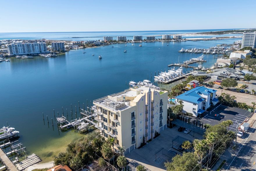 Prime two-bedroom harbor front condo available for lease with large BOAT SLIP INCLUDED at Destin Harbor Place. Located just west of Harbor Docks restaurant, this low-density condo building is perfect for full time or second home living (no short term rentals allowed). This opportunity includes a 70' x 22' boat slip, climate-controlled storage unit, heated pool, onsite fitness room & access to an incredible rooftop deck! This unique location offers an open & spacious floor plan with raised & trayed ceilings, and floor to ceiling windows to maximize the views overlooking the Destin Harbor and Gulf of Mexico. The kitchen features granite breakfast bar, island, stainless fridge & ample storage space. The expansive harbor front balcony can be accessed from the living area & primary bedroom. This impeccable Destin condo, one of only 12 exclusive residences in a five-story condominium building is ideally located right on the water and near many conveniences. Enjoy panoramic views, weekly fireworks, sensational sunsets and an ever-changing panorama of passing boats. Entertain lucky guests on your expansive 38-foot private balcony as you dine al fresco while enjoying the gentle sea breezes. It's also the ideal spot to enjoy your morning coffee with a view. Retire to your private retreat and unwind in your soothing garden tub as you sip wine while watching the lights dance across the harbor. Living here, you'll be just minutes from shopping, dining, Harborwalk Village and everything that Destin has to offer. If you have been dreaming of experiencing the Harbor lifestyle to the fullest, now is your chance! It is rare to have access to a 70 foot boat slip too. Rental is currently unfurnished and will require one month's rent for a deposit. Pets are not allowed. Includes appliances, washer & dryer and majority of utilities are paid by owner. Electric will be paid by the tenant. 