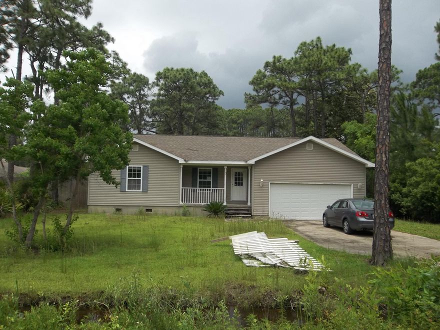 A great price for this home. Located close to Sandestin and beautiful scenic 30A as well as the beaches of South Walton. Close to the Hospital, shopping and restaurants - Fenced back yard. Large lot 140 x 100 better than a quarter acre. Great floor plan including vaulted and trayed ceilings, crown molding, Large garage with extra storage. Other features: tile and carpet, covered front porch, large wood deck in the back, master bedroom has 2 large closets, master bath with double vanity and marble countertop. This property is to be sold as is.