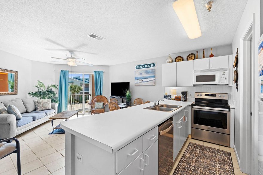 Embrace the beauty of coastal living at Gulfview with this charming one-bedroom, one-bathroom condo just steps away from the pristine sands of Miramar Beach. Located in the sought-after Gulfview community, this second-floor unit offers a perfect blend of comfort, convenience and gulf views, making it an ideal vacation retreat or rental investment. Just 250 feet from your door lies 200 feet of private beach access, exclusively gated for residents and guests. This quiet, family-friendly complex boasts terrific amenities, including a seasonally heated pool, hot tub and a barbecue grilling area, all beautifully landscaped for your enjoyment. From the cozy living room and balcony, take in serene gulf views, and the reflective gulf glimpses from the kitchen add an extra touch of coastal charm. With a full bed in the bedroom, twin bunk beds in the hallway and a sleeper sofa in the living room, this home sleeps up to six, making it perfect for families or small groups. This unit also had a new hot water heater and new water shut off valve both installed in January 2025 and a new HVAC in 2023. 

Gulfview II 205 offers a true beach lifestyle experience  whether it's morning bike rides along Scenic Highway 98, enjoying nearby restaurants like Kenny D's and Pompano Joe's, or spending your days lounging by the beach. Deeded beach access, convenient proximity to area attractions and a relaxed coastal vibe make this condo a standout property along the Emerald Coast.

With no elevator on-site, this well-maintained and fully furnished unit is a peaceful retreat offering everything you need for a stress-free beach getaway.