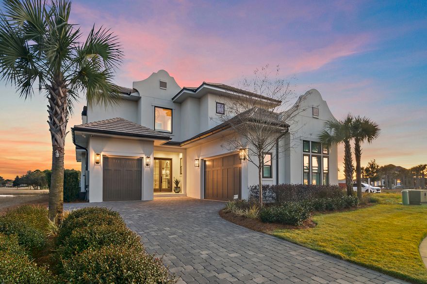 Located in Regatta Bay's newest community, Tradewinds, this exceptional luxury coastal home showcases refined craftsmanship and timeless design. Built in 2022 by Legendary Home Builders, the home features West Indies architecture with Dutch influence, thoughtfully curated for elegant coastal living. Offering 4 bedrooms, 4 full baths, 2 half baths and a 3‑car garage, this smart home spans 3,078 sq. ft. of heated/ cooled living space and is filled with hand‑selected designer finishes throughout. Hardwood floors flow seamlessly through the home, complemented by quartzite countertops, custom tiled showers and elevated details at every turn. The master bedroom is a true retreat, featuring a large walk-in closet, a spa‑inspired bath with a soaking tub, and separate walk‑in shower. A first-floor guest bedroom with private bath, powder room and spacious laundry room with sink provide both comfort and convenience. Designed for entertaining, the large gourmet kitchen is equipped with top-of-the-line features and opens to the expansive living area. Step outside to the screened outdoor living space with summer kitchen, private pool and spa and spectacular views of the lake and golf course the perfect setting for year-round enjoyment. Upstairs, a versatile bonus/flex space is joined by two additional bedrooms, each with private en-suite baths, offering privacy and flexibility for family or guests. Last but certainly not least the home offers and whole house generator. Built by Legendary Home Builders, utilizing only the finest materials and high end finishes such as: wind and impact resistant windows, wind and impact rated doors, insulated wind and impact rated garage doors, insulation in all interior walls for energy efficiency, sound proofing insulation between floors for sound barrier, stainless steel door hinges, custom wood shelving in all closets, Kohler plumbing throughout, custom solid wood cabinetry throughout with soft close hinges, surround sound, smart home technology, led lighting throughout and so much more...This remarkable home combines luxury, location, and lifestyle in one of Destin's most desirable gated communities. Regatta Bay is a serene, gated community that seamlessly blends golf and boating, offering a lifestyle that is truly unparalleled! The essence of the Regatta Bay Lifestyle revolves around convenience, allowing residents to easily access numerous enjoyable destinations within minutes via golf cart, including the beach! Within the community, residents can indulge in golf, swimming, tennis, pickleball, parks, playgrounds, the Regatta Bay Clubhouse, Legendary Marine, and Legendary Yacht Club. Furthermore, Regatta Bay features a private road that leads directly to the Destin Commons, where an array of popular retail stores for both men and women await, alongside a diverse selection of restaurants, Whole Foods, Bass Pro, Lowes, an AMC movie theater, and Uncle Buck's Bowling-all easily reachable by golf cart. Regatta Bay is centrally located offering easy access to the airport and only a few miles from Northwest Florida's finest hospital. Schedule your private tour today and experience the elegance of Regatta Bay living.