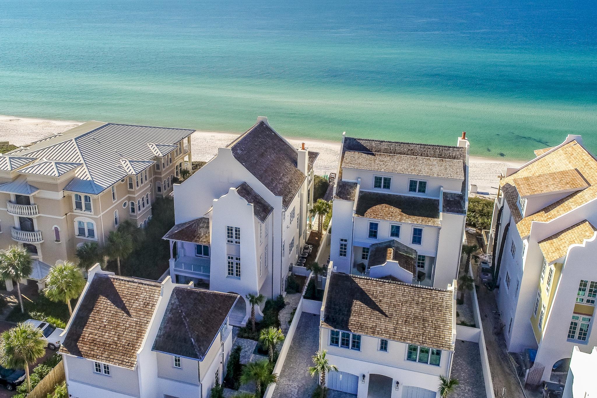 Reigning on 60' of Gulf frontage atop the Bluffs at Sandy Shores, this iconic estate affords unprecedented coastal living. The low-density gated enclave of residences is prominently situated between Rosemary Beach and Alys Beach along 30A in Northwest Florida. Curated by the world-renowned team at Chancey Design Partners, this one-of-a-kind manor showcases a coastal design vision brought to life with the highest quality materials and finishes.Overlooking one of the most sought-after beaches in the US, the breath-taking views of the sugar white sands and the emerald green hued waters can be enjoyed throughout all three levels of the home. Concrete fortified construction paired with exquisite design creates an unparalleled experience of seaside living.